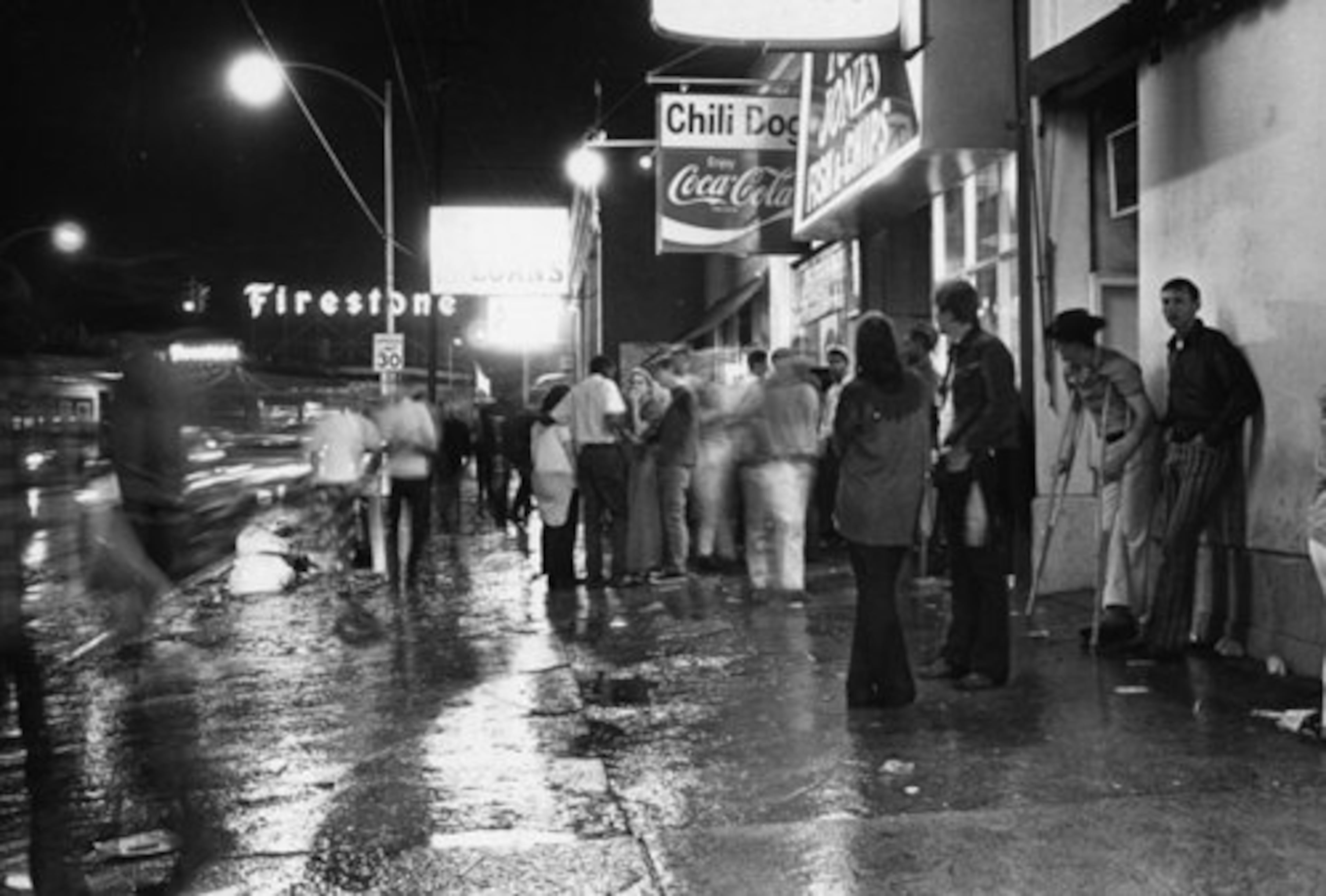 Young street people gather near 10th Street in 1970.