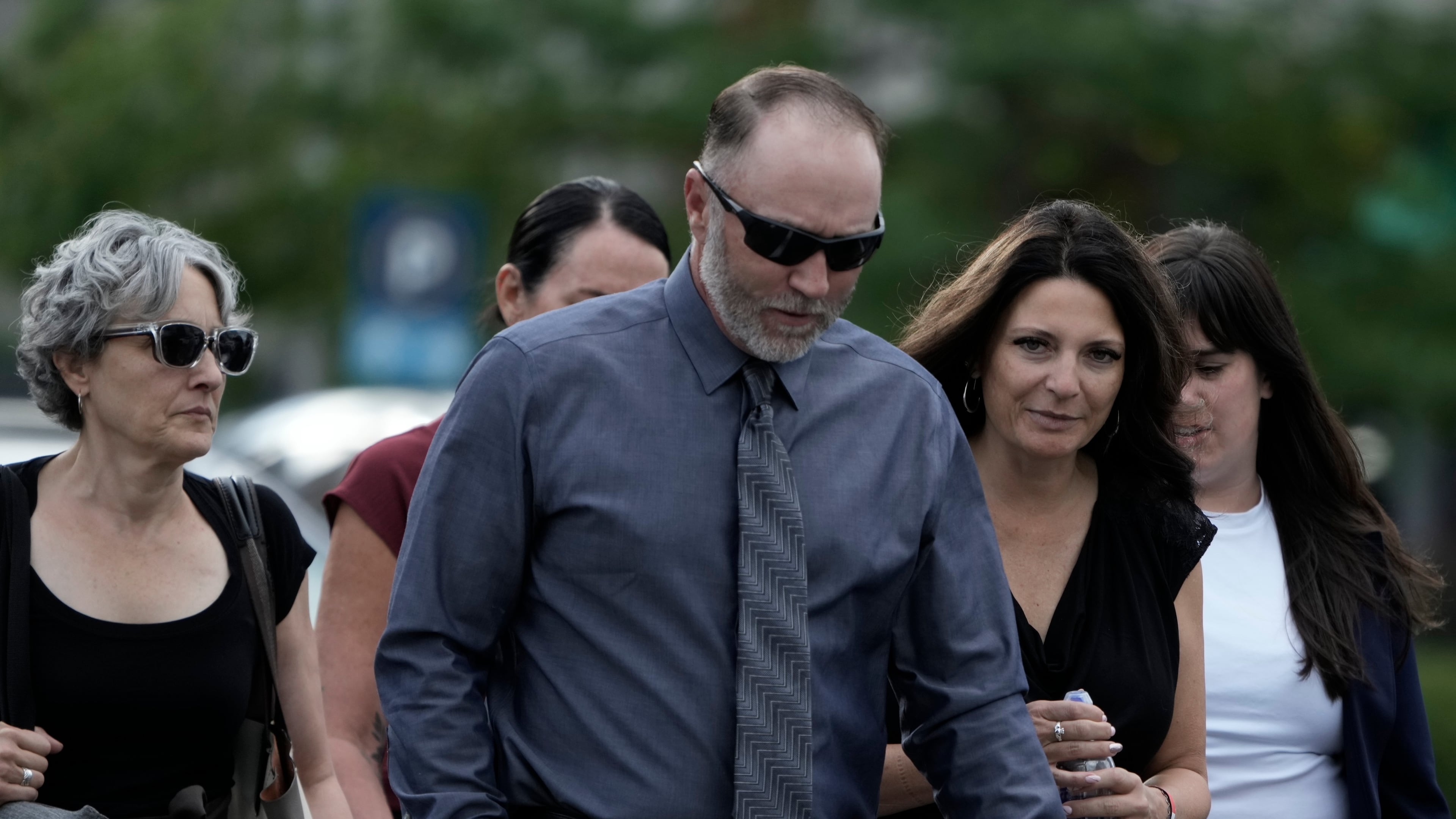 Matt Robinson, father, and Amber Robinson, mother, second right, of Tyler Robinson arrive at the Fourth District Courthouse, Tuesday, July 7, 2026, in Provo, Utah, ahead of a hearing for Tyler Robinson, accused in the fatal shooting of Charlie Kirk. (AP Photo/Spenser Heaps)