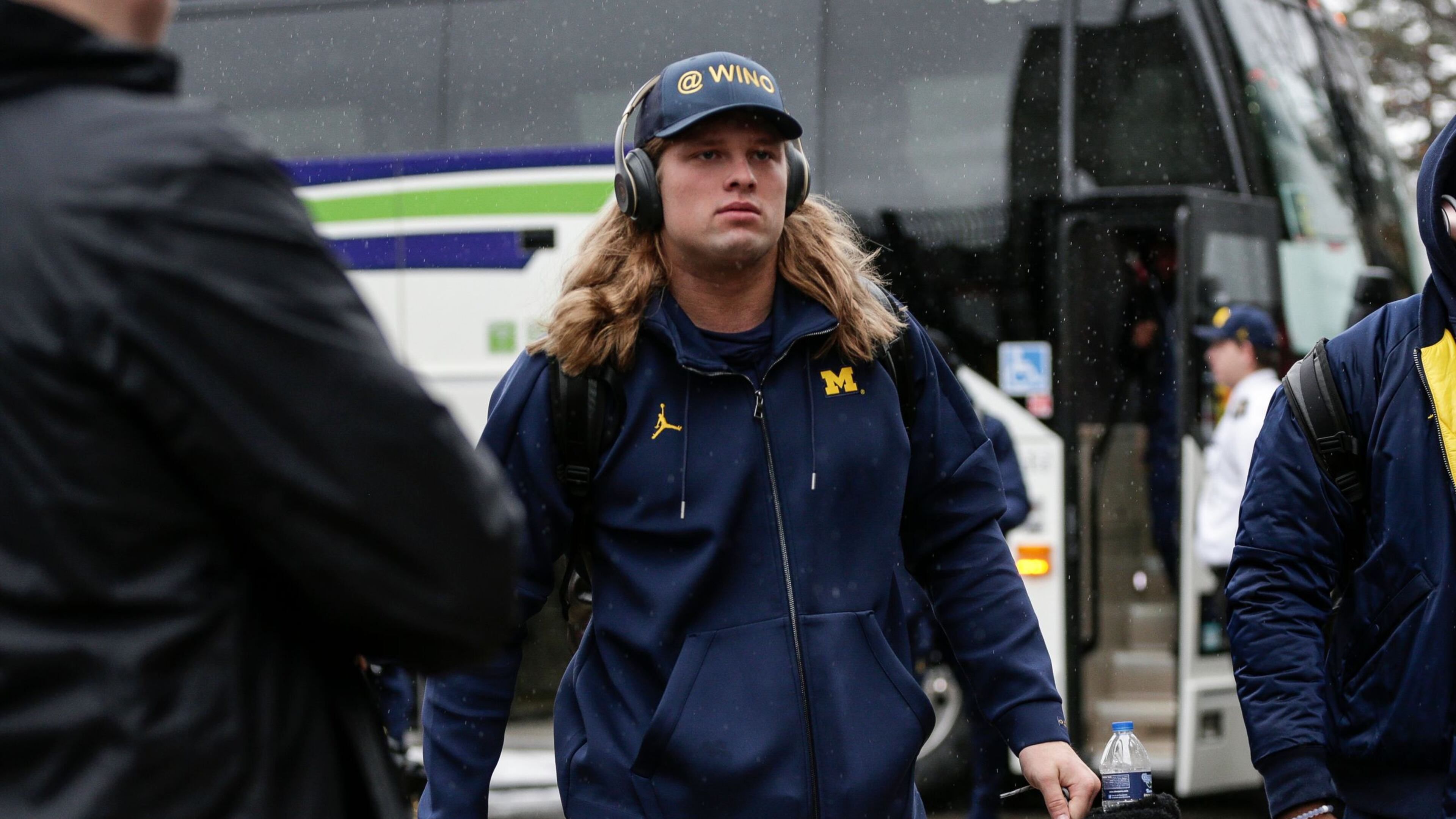 Michigan defensive line Chase Winovich walks off the bus as the team arrive at Ohio Stadium in Columbus, Ohio before the OSU game, Saturday, Nov. 24, 2018.