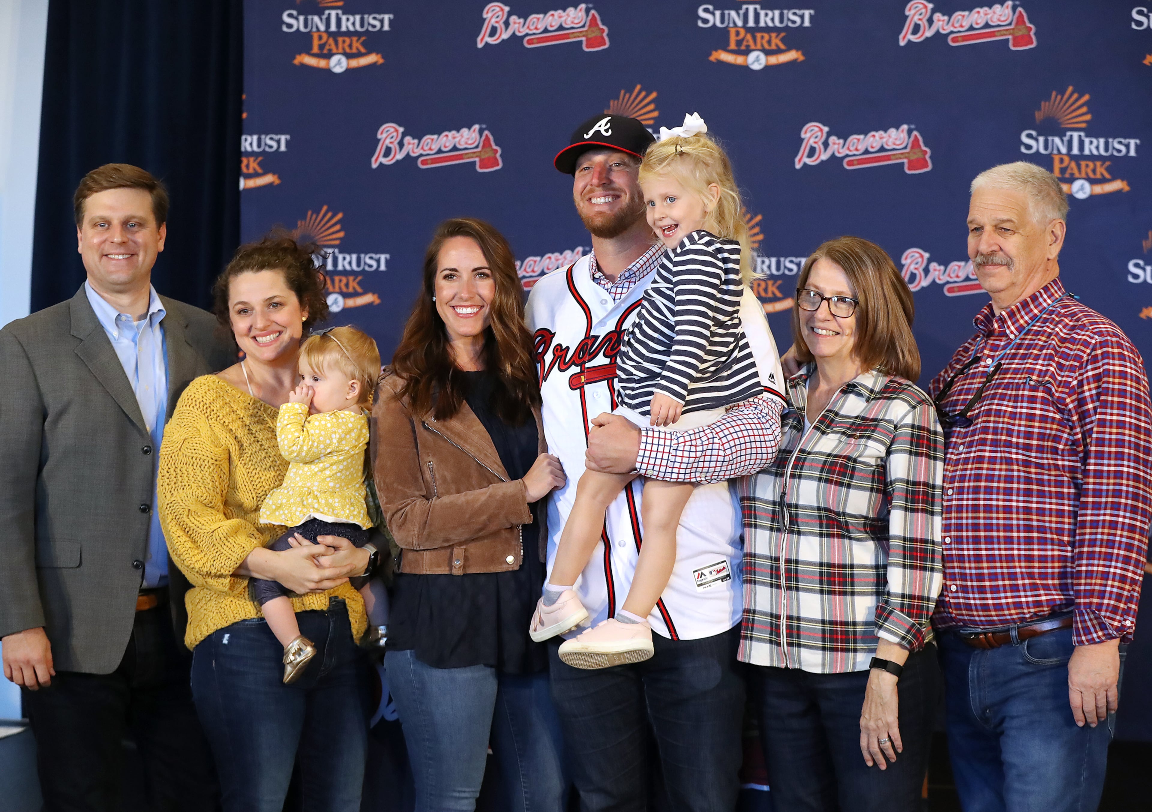 Braves pitcher Will Smith poses with his parents Kay and Charles Smith (right), his fiancee Taylor Dunagan (to Smith's right) and his sister Charlie Bass (far left), with her husband David and their children Laney, 3, and Libby, 10-months. Curtis Compton/ccompton@ajc.com