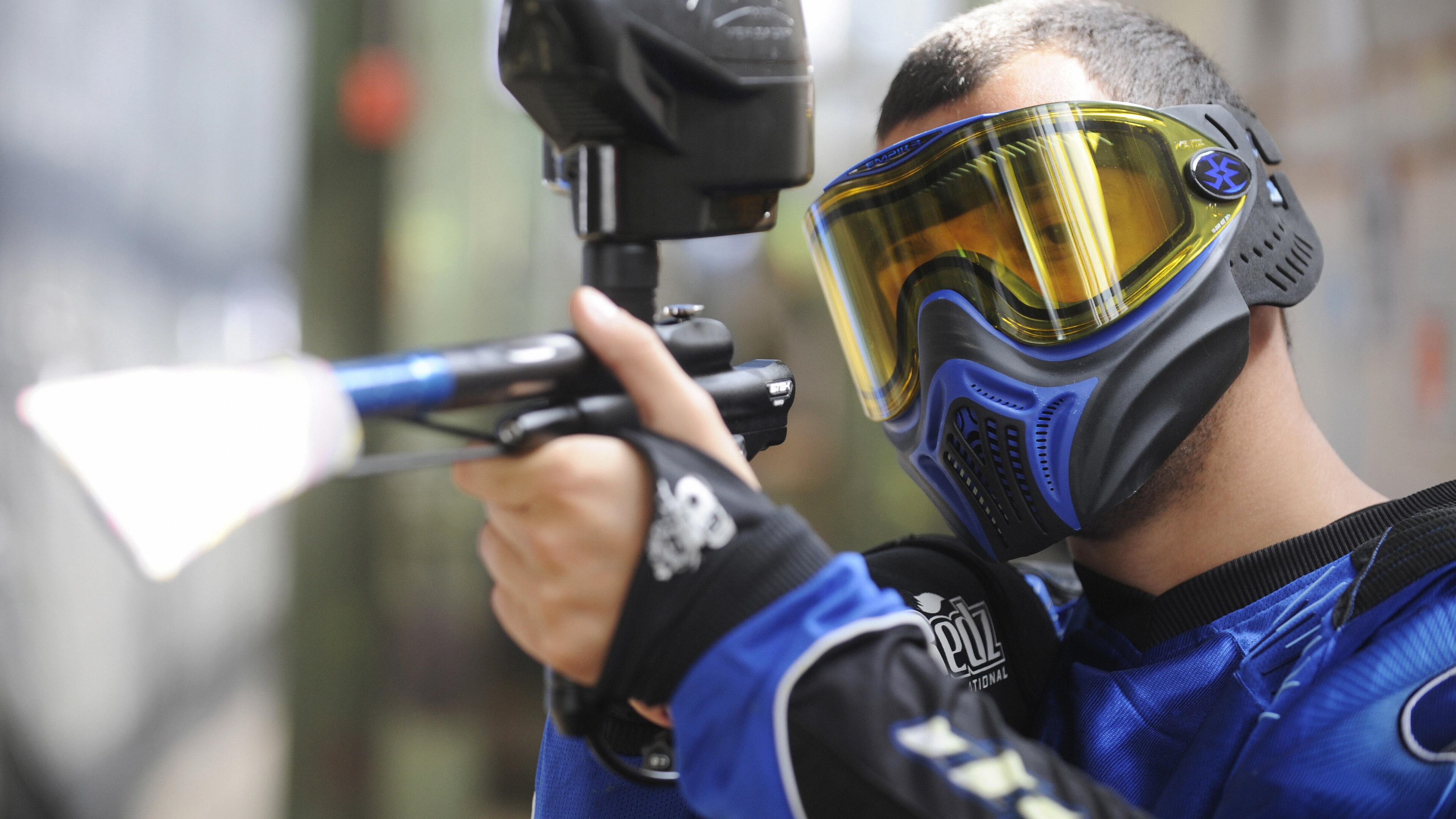 A German paintball enthusiast poses with his weapon in a paintball hall in Berlin in May 2009.