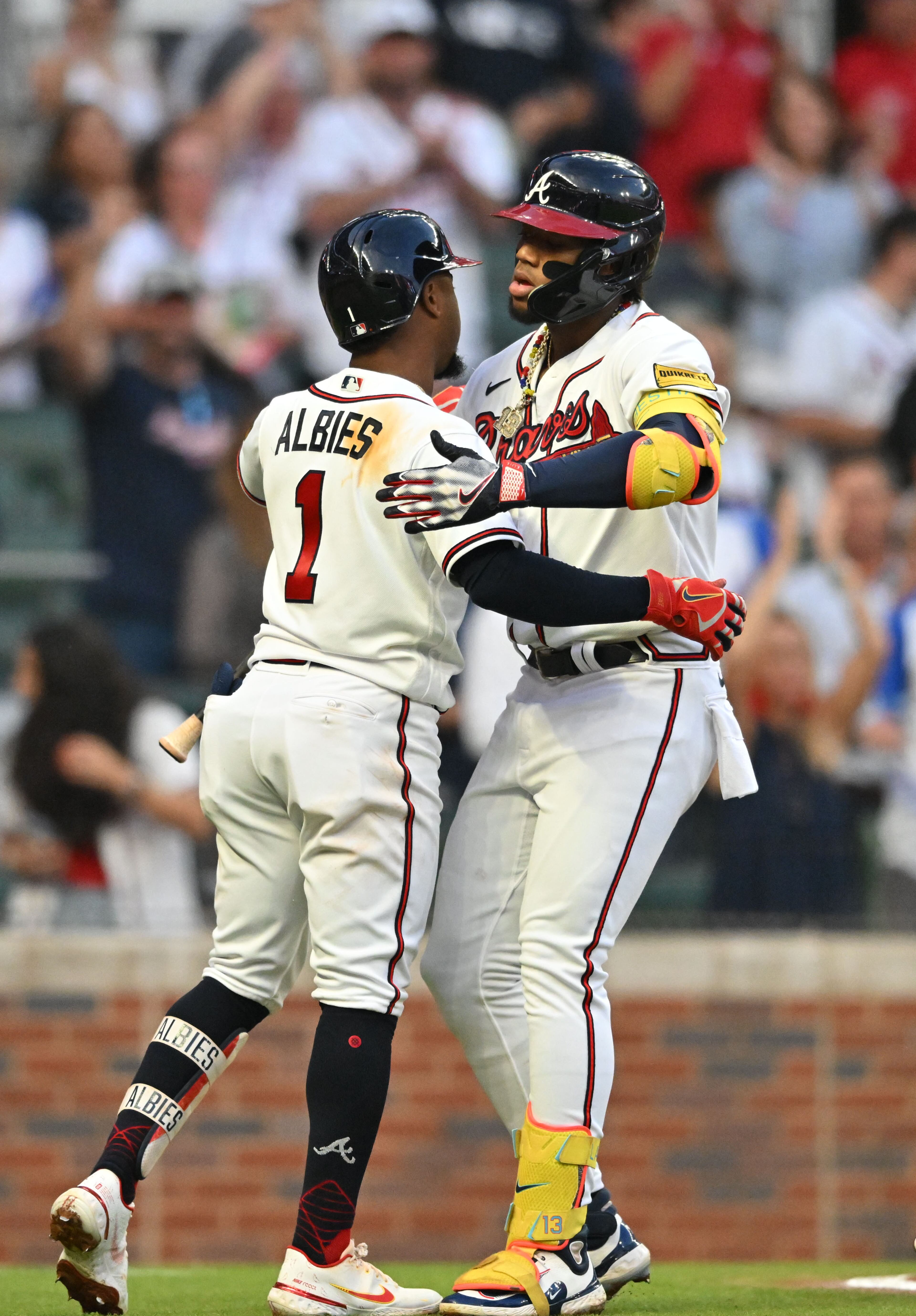 Atlanta Braves right fielder Ronald Acuna Jr. (13) celebrates with second baseman Ozzie Albies (1) after hitting a solo home run during the first inning at Truist Park, Tuesday, September 19, 2023, in Atlanta. (Hyosub Shin / Hyosub.Shin@ajc.com)