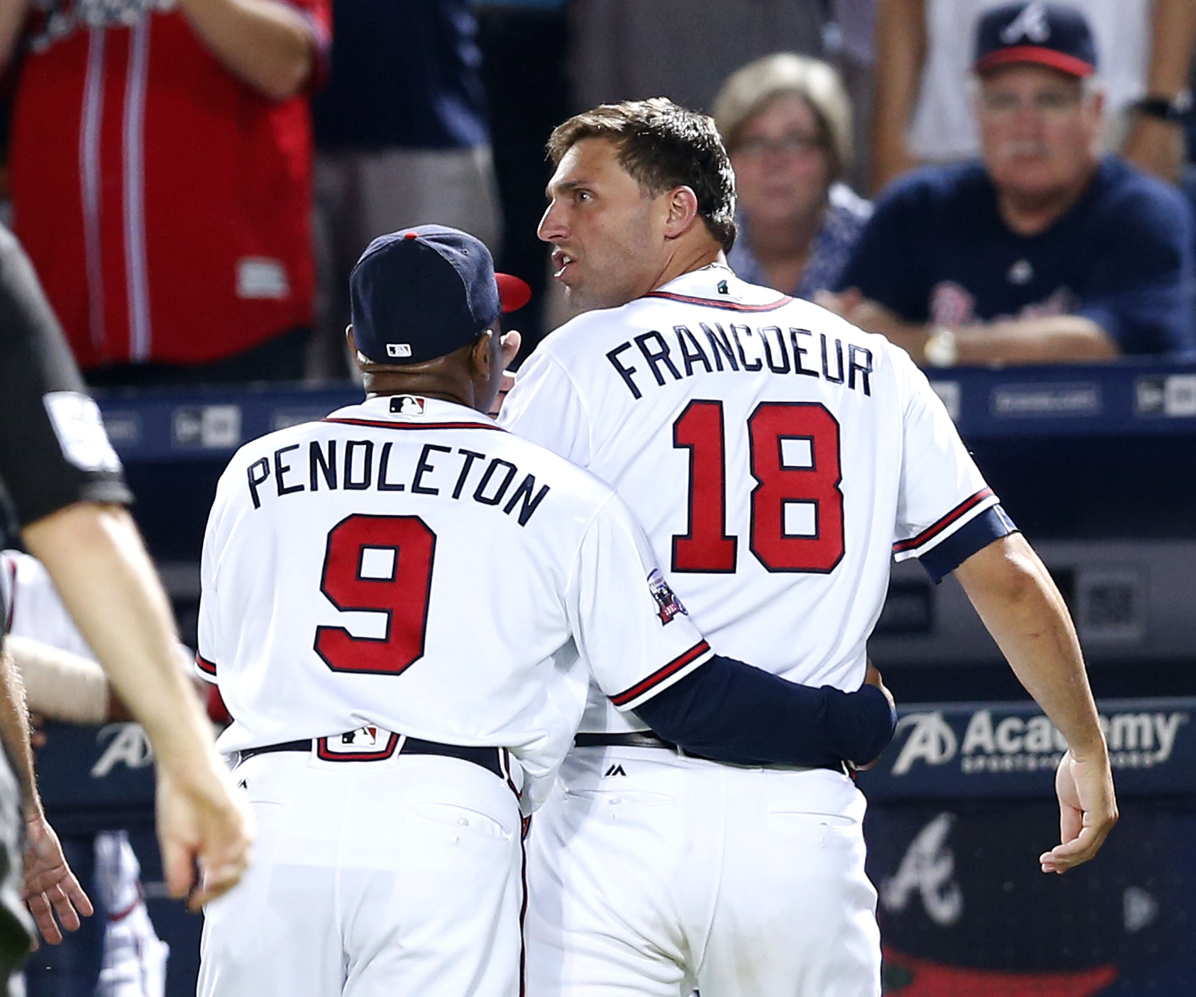 Braves coach Terry Pendleton #8 restrains outfielder Jeff Francoeur #18 after arguing a replay review call in the ninth inning during the game against the Cleveland Indians at Turner Field on June 28, 2016 in Atlanta, Georgia. (Photo by Mike Zarrilli/Getty Images)