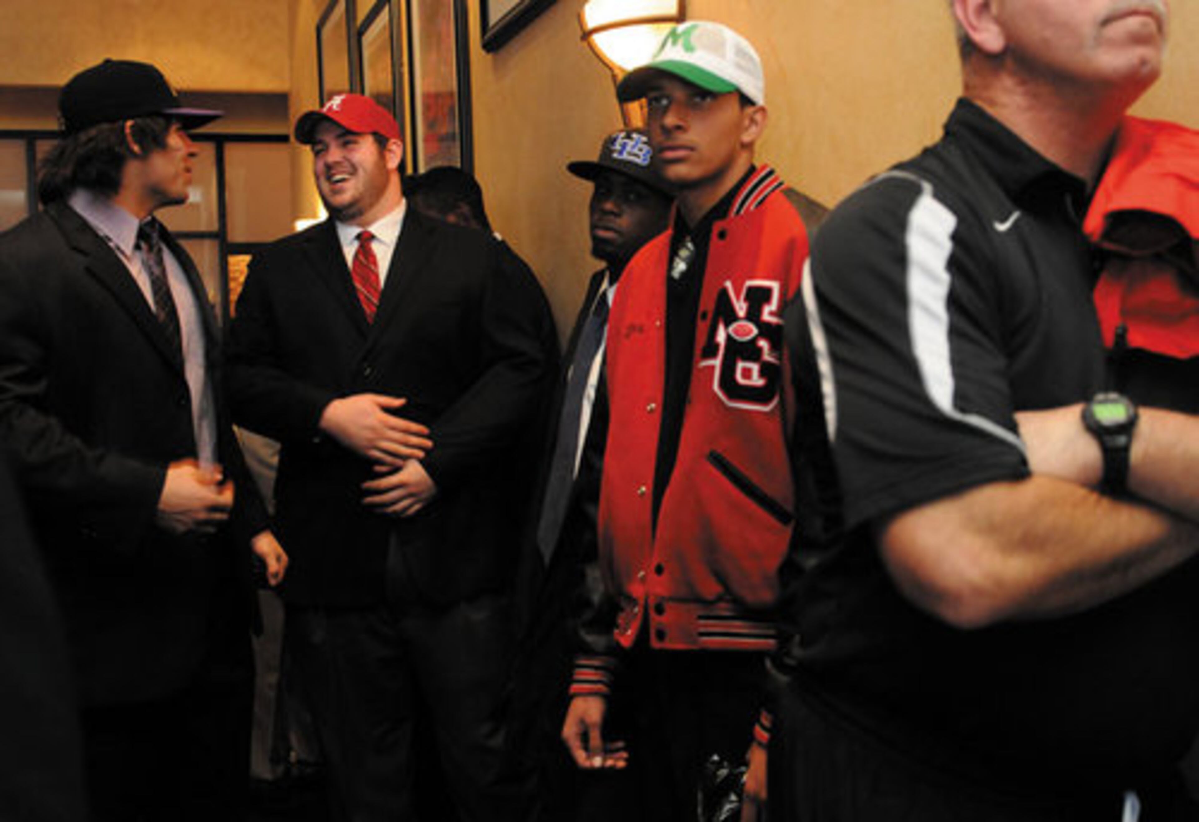 From left, Cameron Fordham of Northview High School who signed with LSU talks with Austin Shepherd of North Gwinnett High School who signed with Alabama.