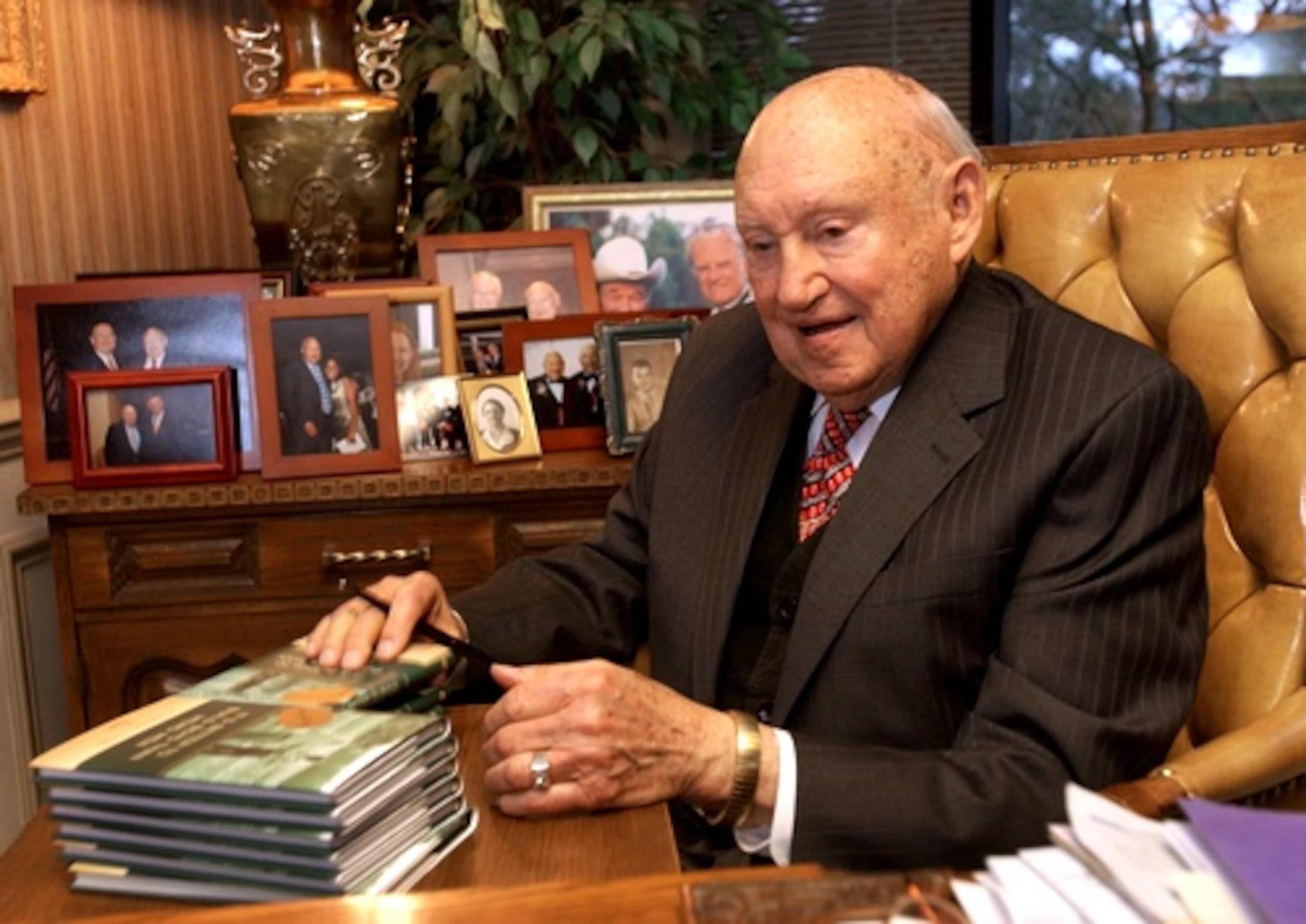Cathy autographs copies of his then-new book "It's Easier to Build Boys Than Mend Men," in his office at company headquarters in January 2005.