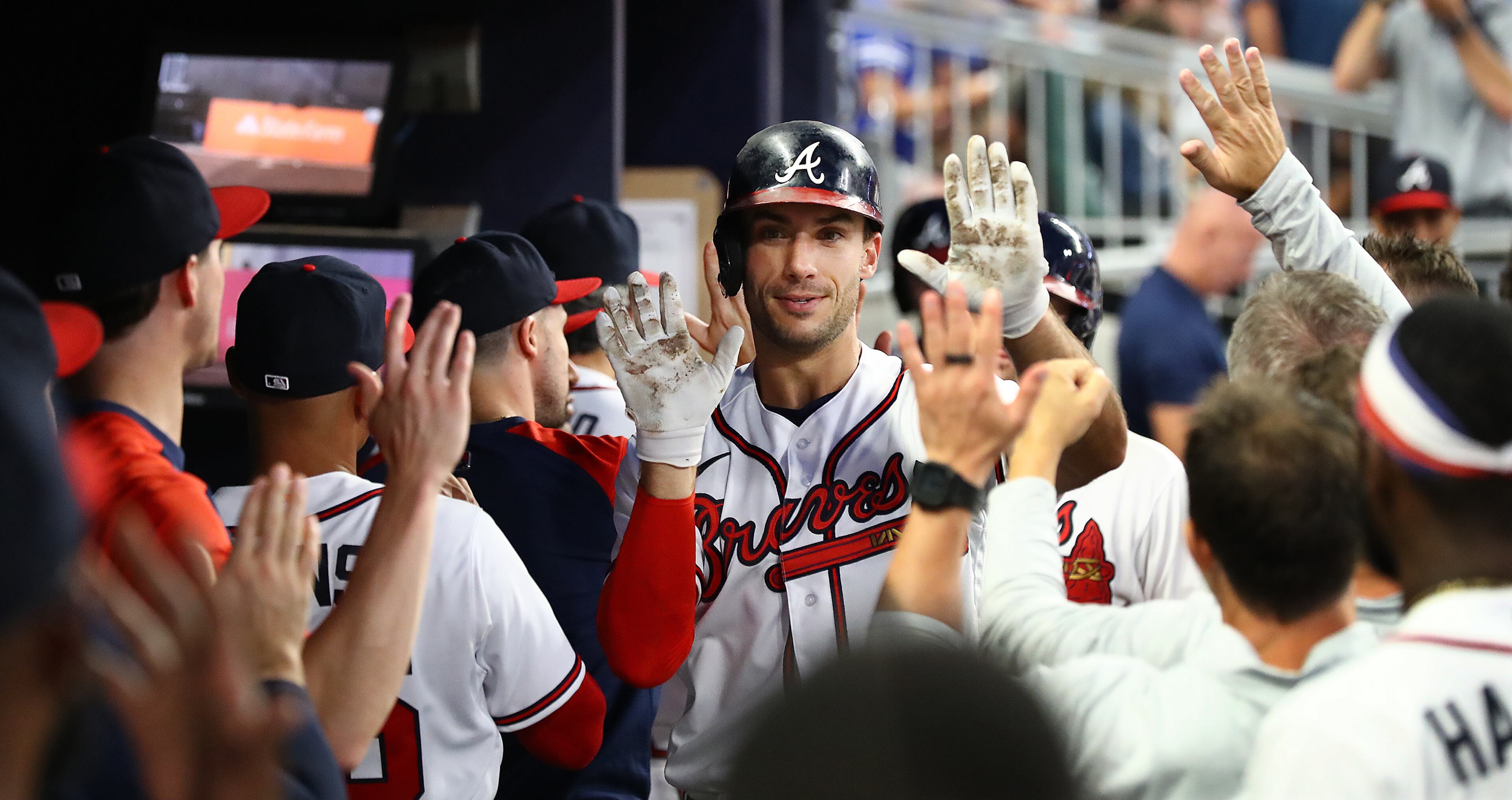 Braves first baseman Matt Olson gets high fives all around in the dugout hitting a 2-RBI home run to take a 3-0 lead over the New York Mets during the fourth inning in a MLB baseball game on Tuesday, August 16, 2022, in Atlanta. “Curtis Compton / Curtis Compton@ajc.com