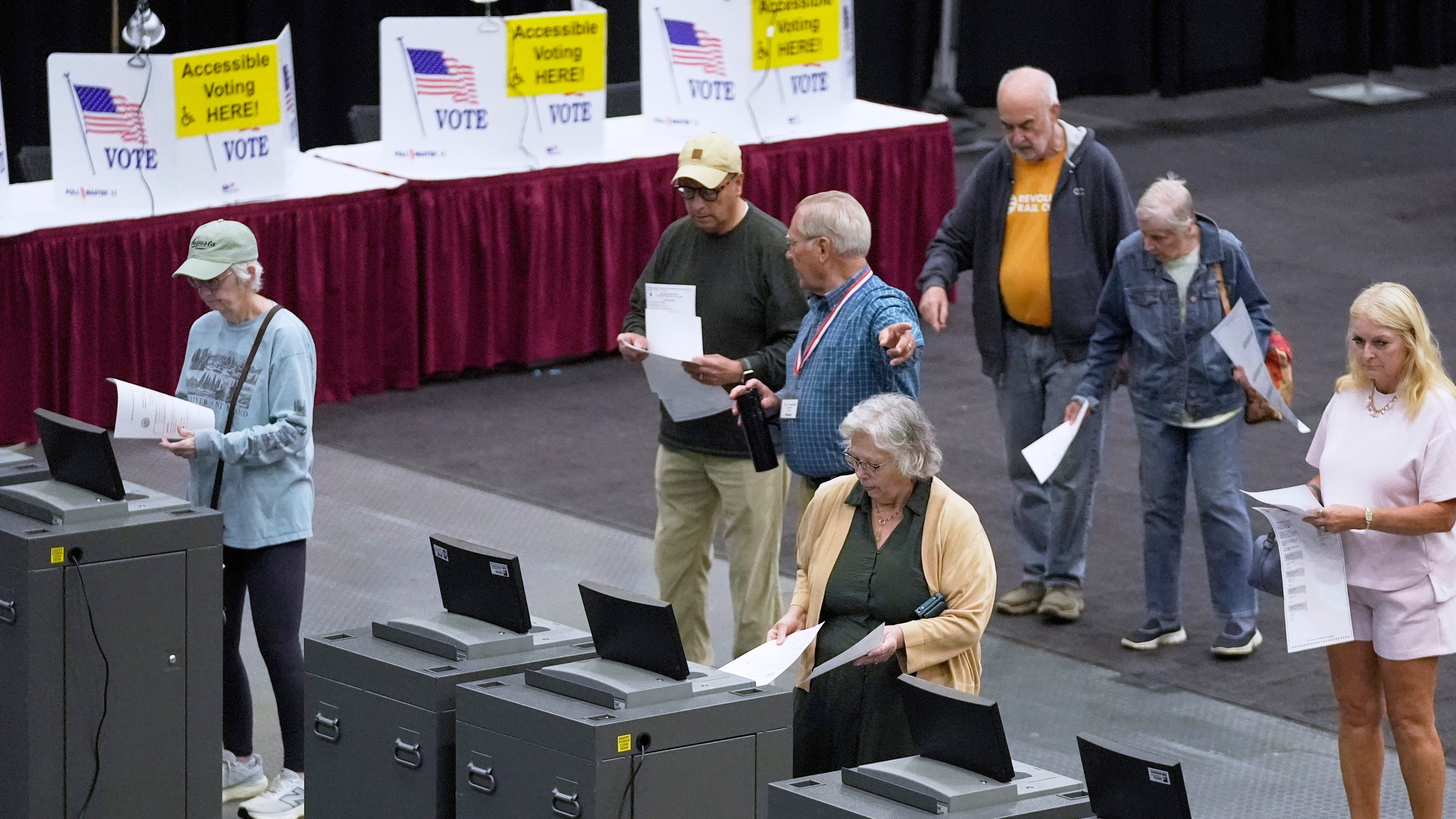 FILE - Voter cast their Maine primary ballots at the Civic Center, June 9, 2026, in Augusta, Maine. (AP Photo/Robert F. Bukaty, File)