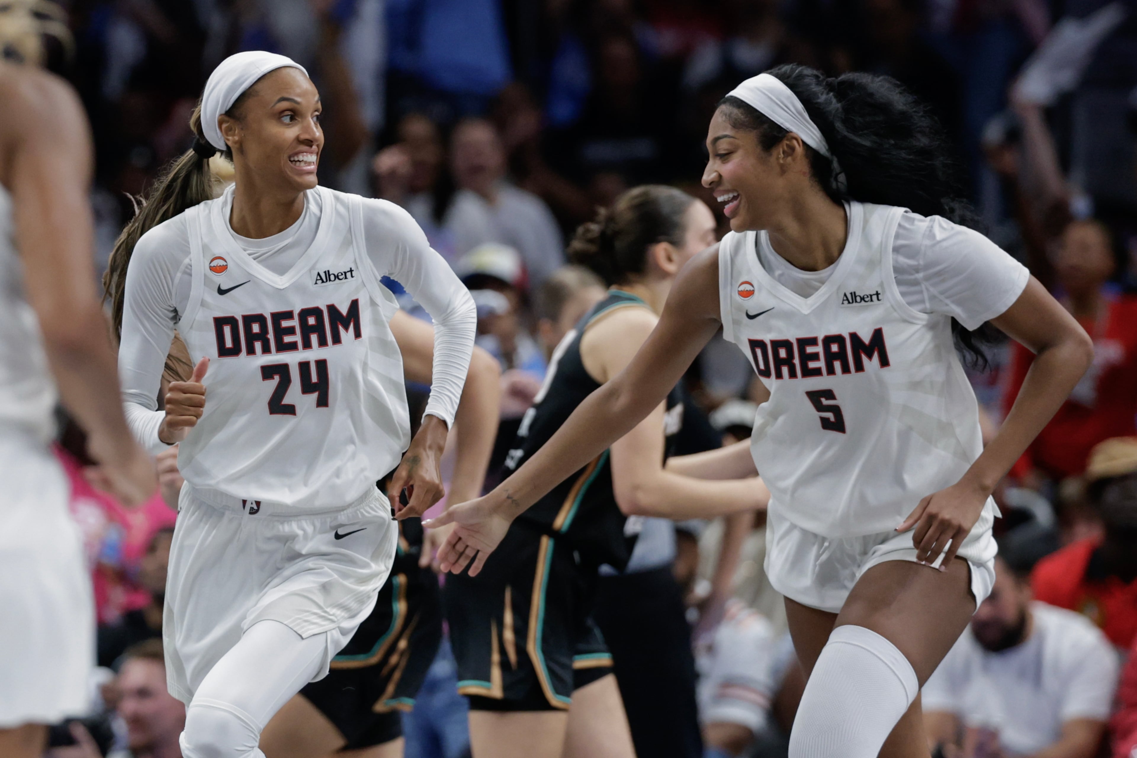 Atlanta Dream forward DeWanna Bonner (24) and forward Angel Reese (5) react during the second half of a WNBA semifinal playoff game 1 between the Atlanta Dream and the New York Liberty, Sunday, Oct. 4, 2026, in Atlanta. (Erik S. Lesser for the AJC)