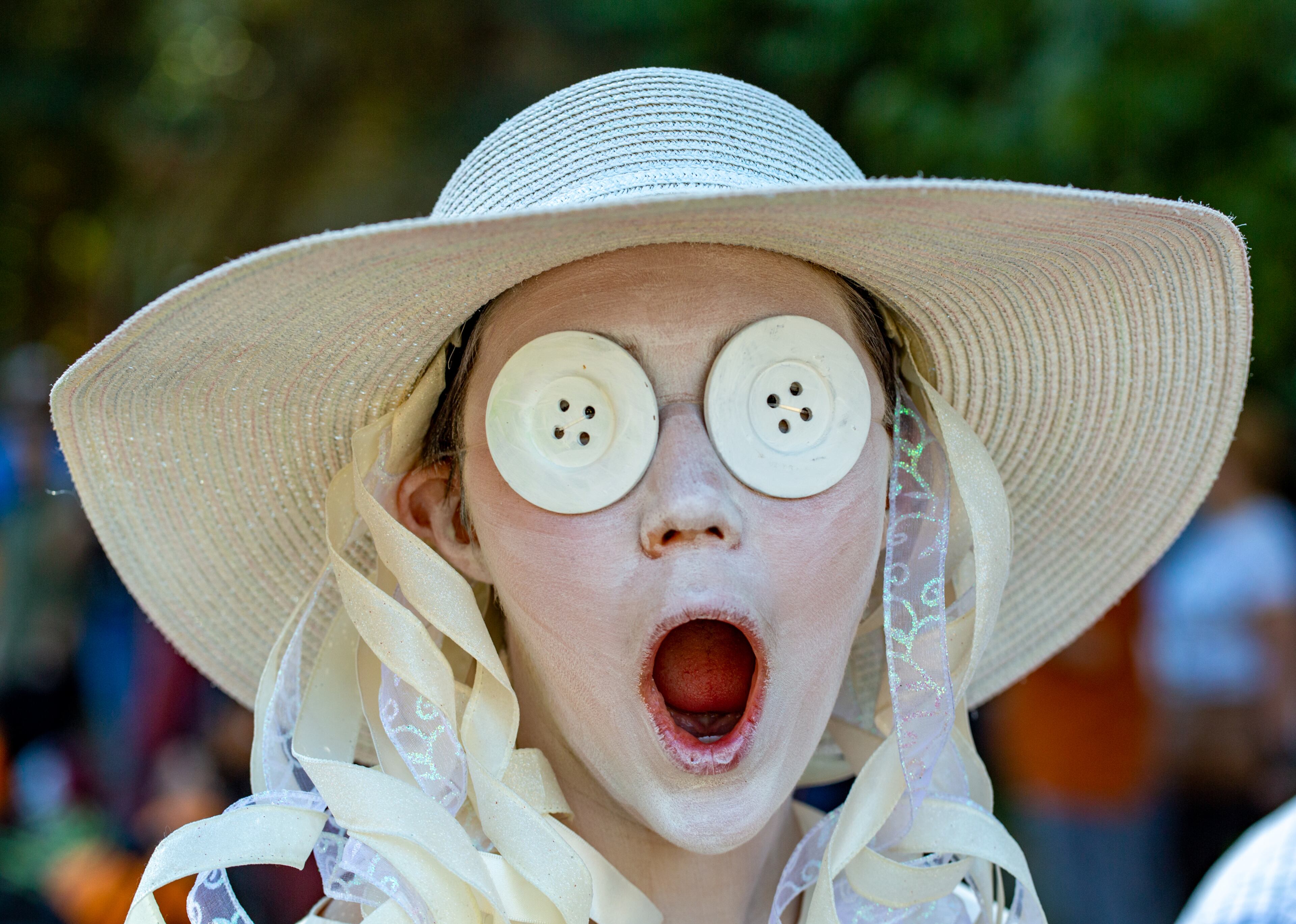 Copper Wilkinson, 14, is Coraline in the annual Little Five Points Halloween Parade on Sunday, Oct 23, 2022. (Jenni Girtman for The Atlanta Journal-Constitution)