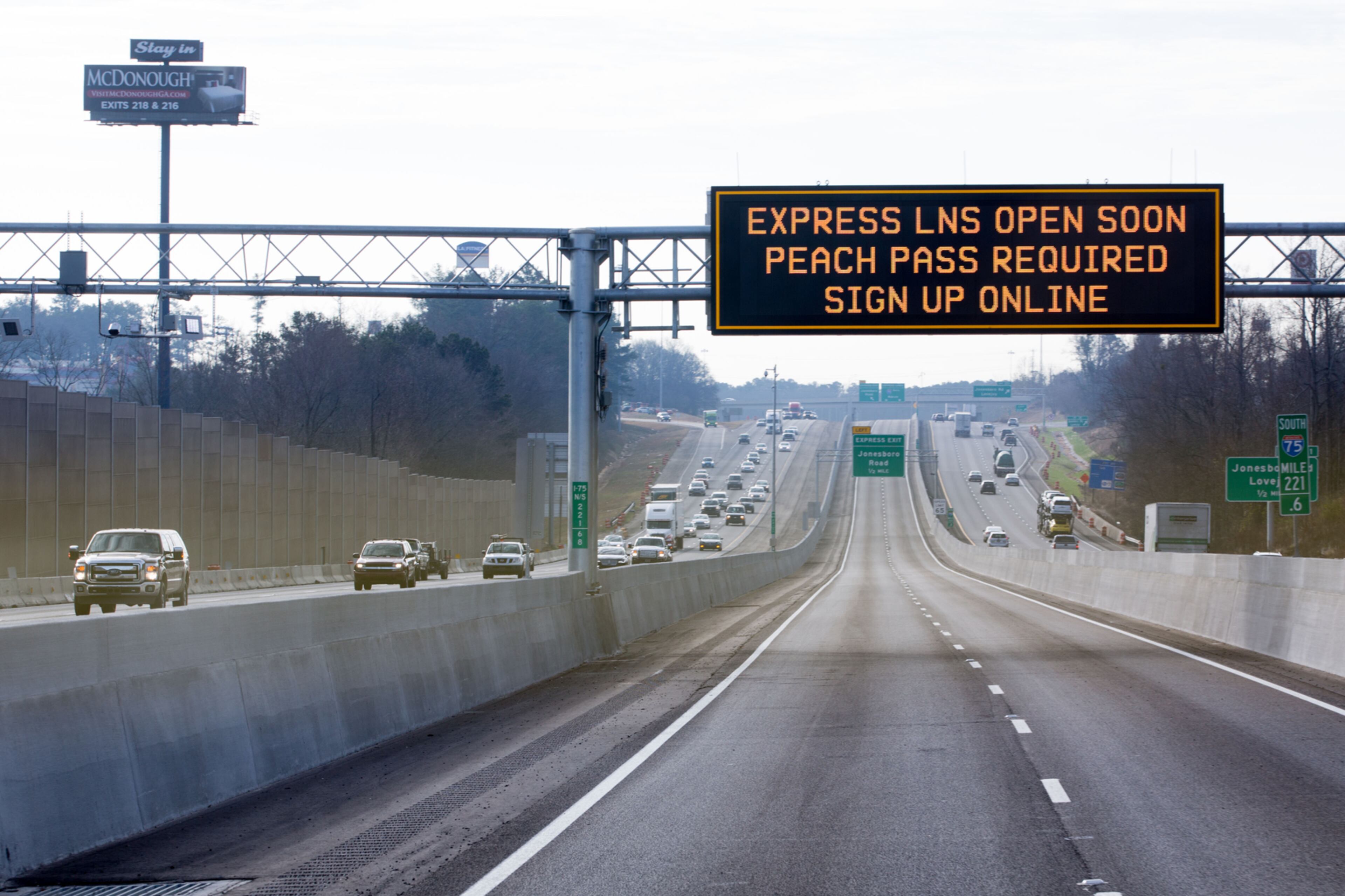 A sign is displayed informing drivers of the new reversible lanes on I-75, Thursday, Jan. 19, 2017, in McDonough, Ga. BRANDEN CAMP/SPECIAL
