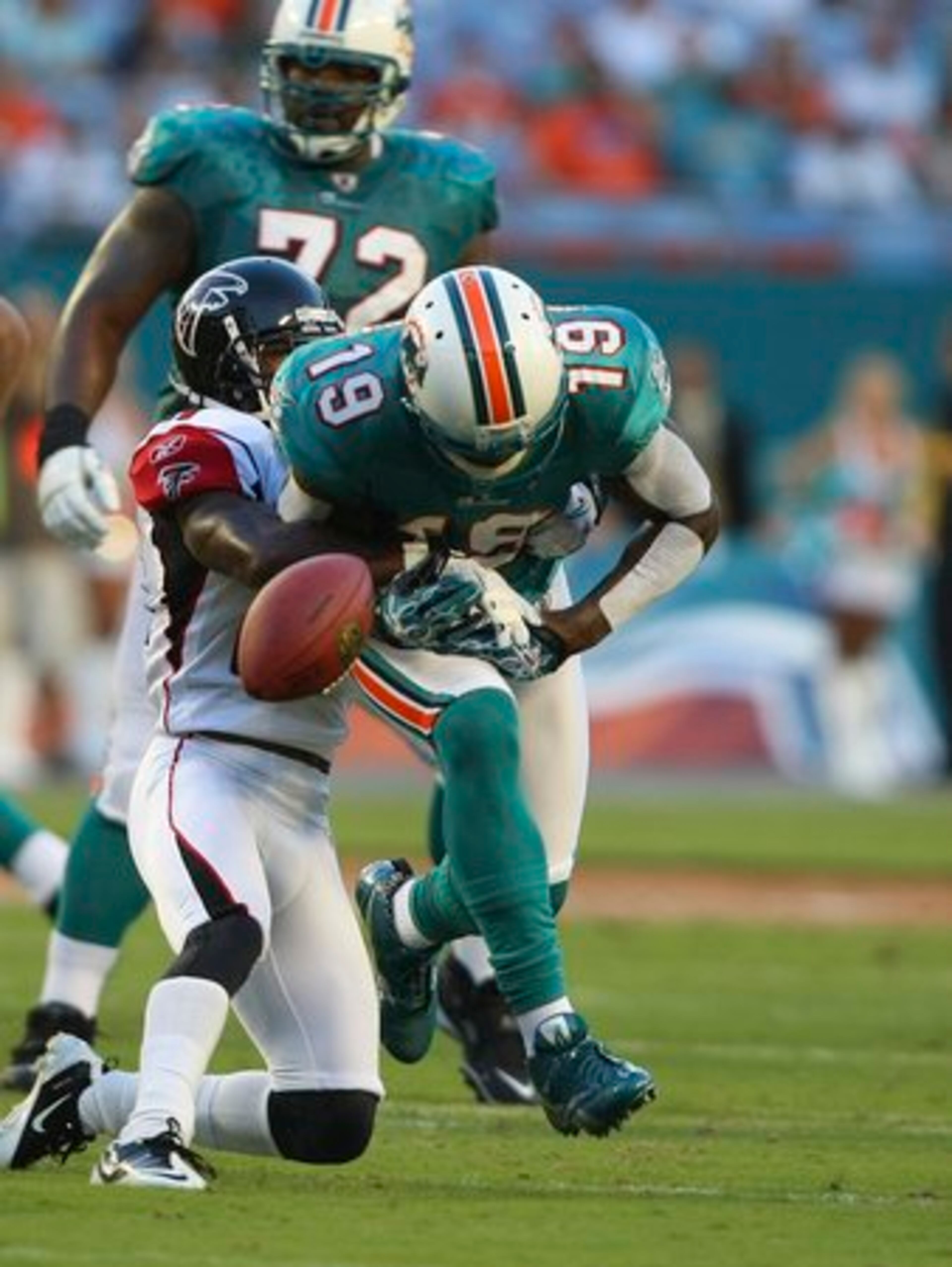Atlanta Falcons corner back Christopher Owens (21) applies pressure as Miami Dolphins wide receiver Brandon Marshall (19) fails to catch a pass during first quarter NFL preseason football action in Miami, Friday, Aug. 237, 2010.