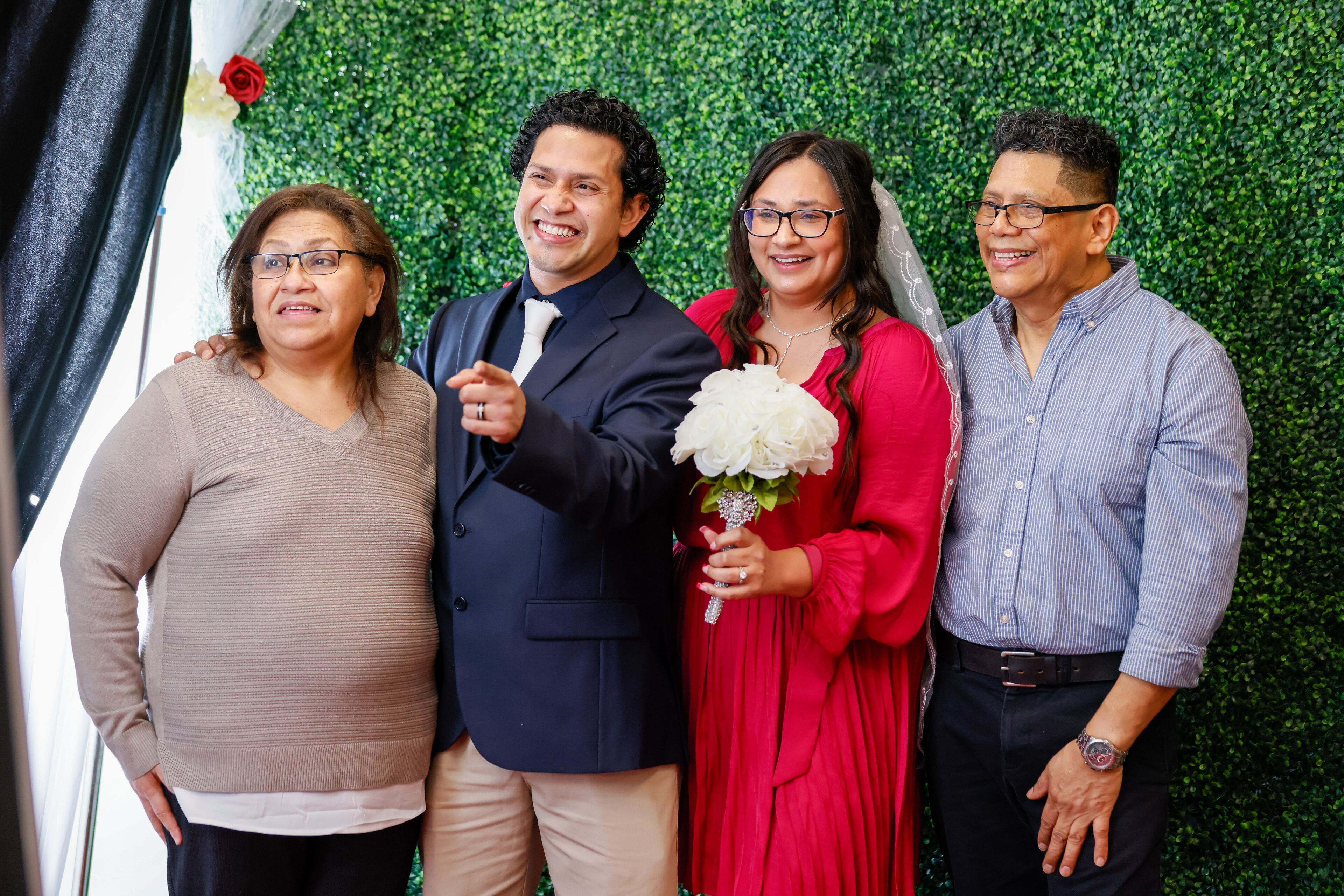 Crosby Pavon and his wife Ashley Morales (center) pose at the photo booth with Jose and Marlene Pavon after they married during Valentine’s Day Free Weddings at the Fulton County Probate Court on Wednesday, Feb. 14, 2024, in Atlanta.
Miguel Martinez /miguel.martinezjimenez@ajc.com