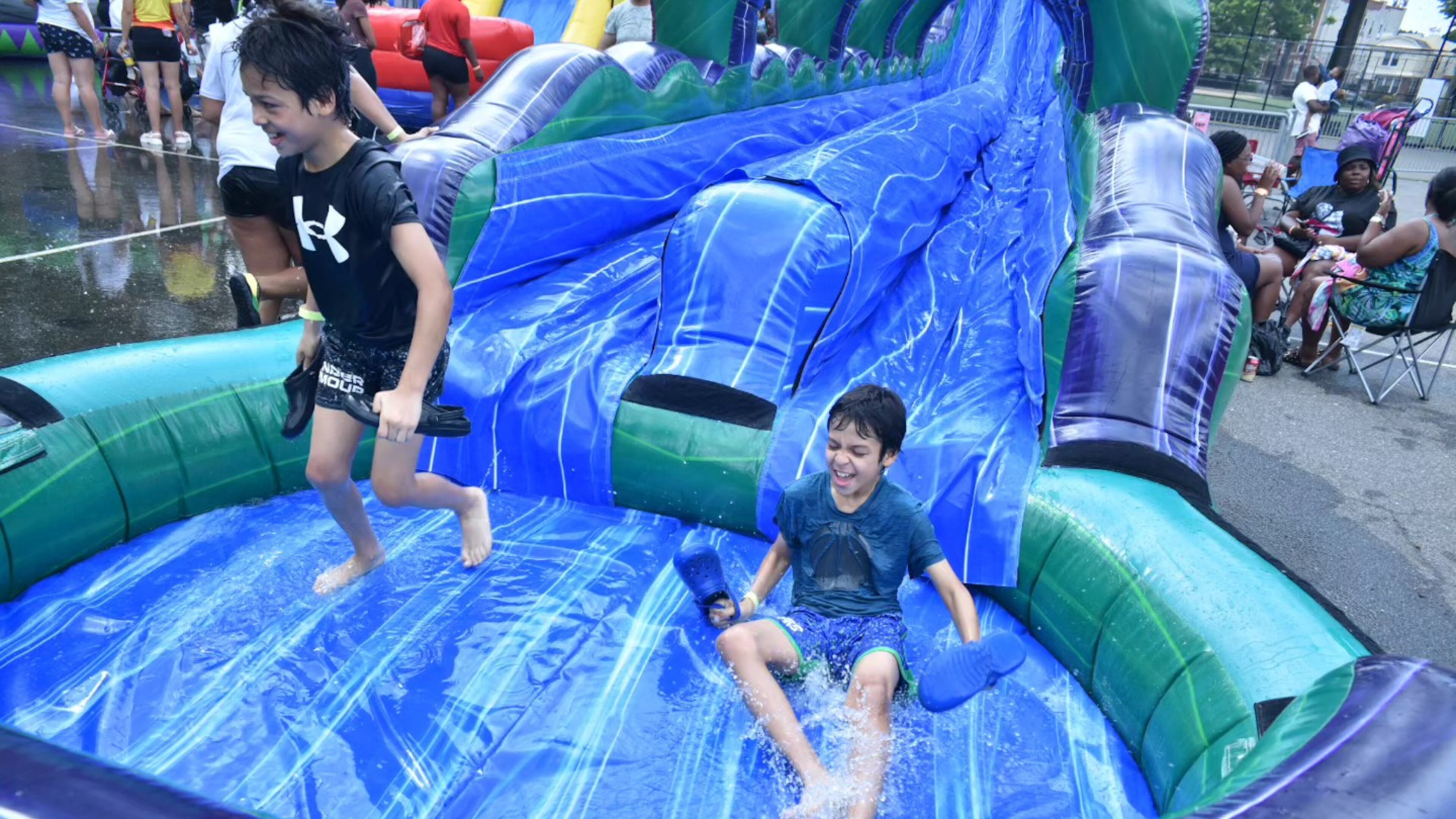 You can slide down more than 25 inflatable water slides, navigate an obstacle course and more at the pop-up Slide City Waterpark at Atlantic Station. (Courtesy of Slide City Waterpark)