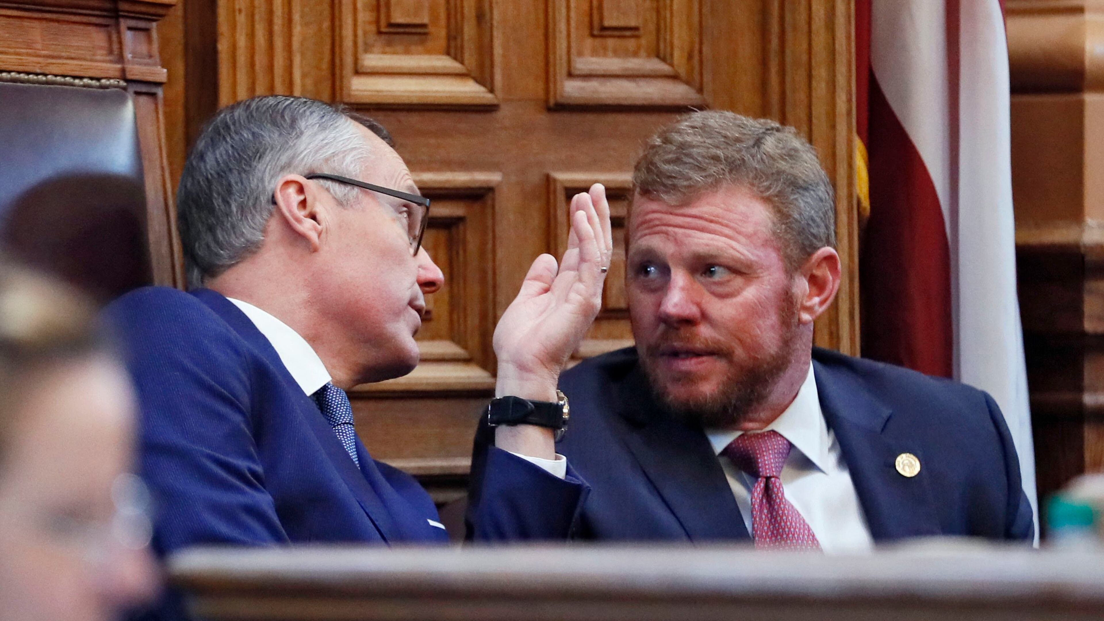 Lt. Gov. Casey Cagle and Chris Riley, Gov. Nathan Deal's chief of staff, confer in the Senate on the Delta/NRA flap. BOB ANDRES /BANDRES@AJC.COM