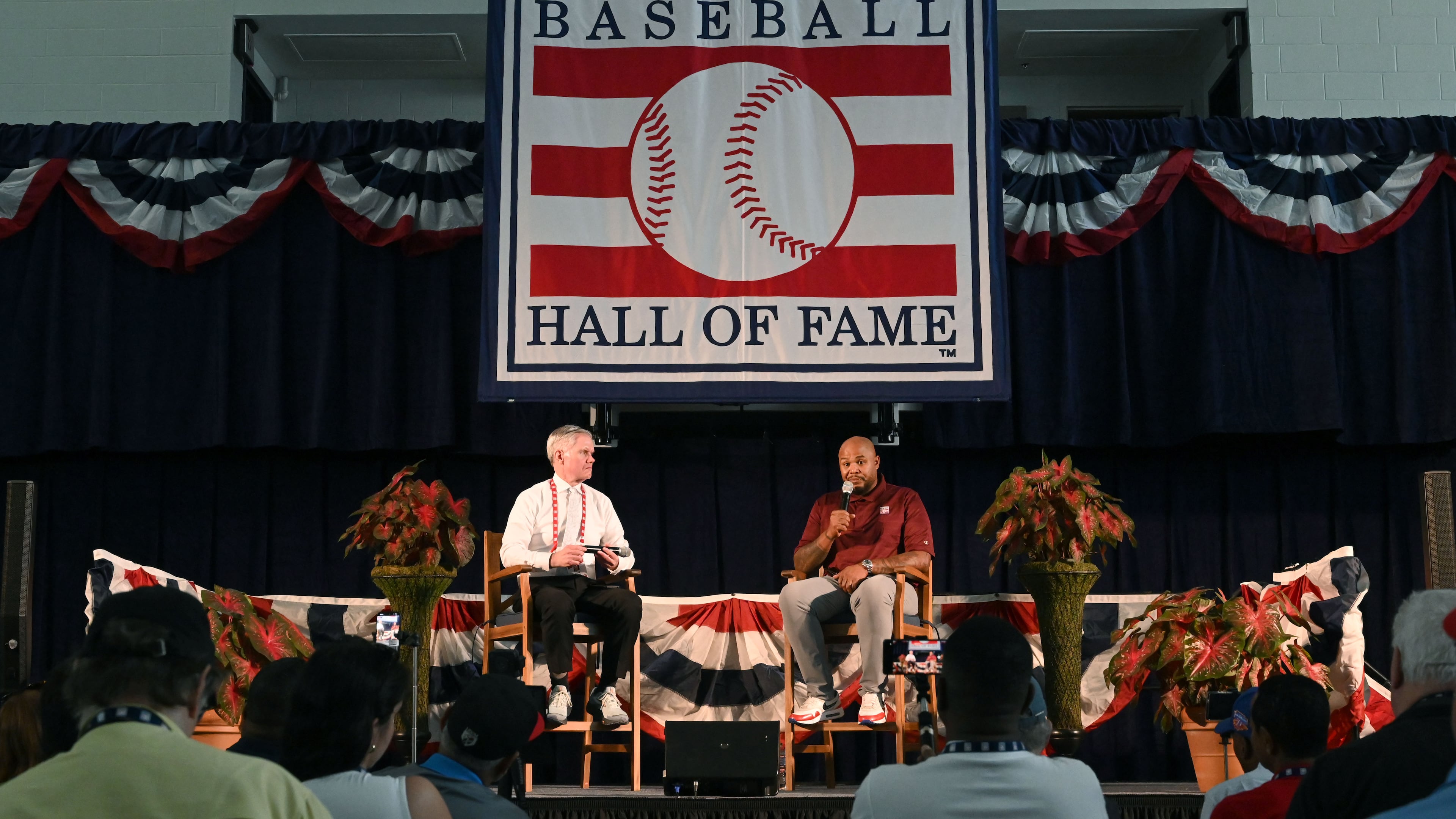 Andruw Jones speaks to members of the press as Craig Muder, communications director, moderates a press conference at the Clark Sports Center on Saturday, July 25, 2026, in Cooperstown, N.Y. Andruw Jones will be inducted into the National Baseball Hall of Fame on Sunday as part of the Class of 2026, alongside Carlos Beltrán and Jeff Kent. Jones will become the 12th player with ties to the Atlanta Braves to be inducted into the Hall of Fame. The beloved Braves center fielder was known for his defensive acumen and towering power. He also exuded a “coolness” that helped make him one of the most popular players in franchise history. (Hyosub Shin/AJC)