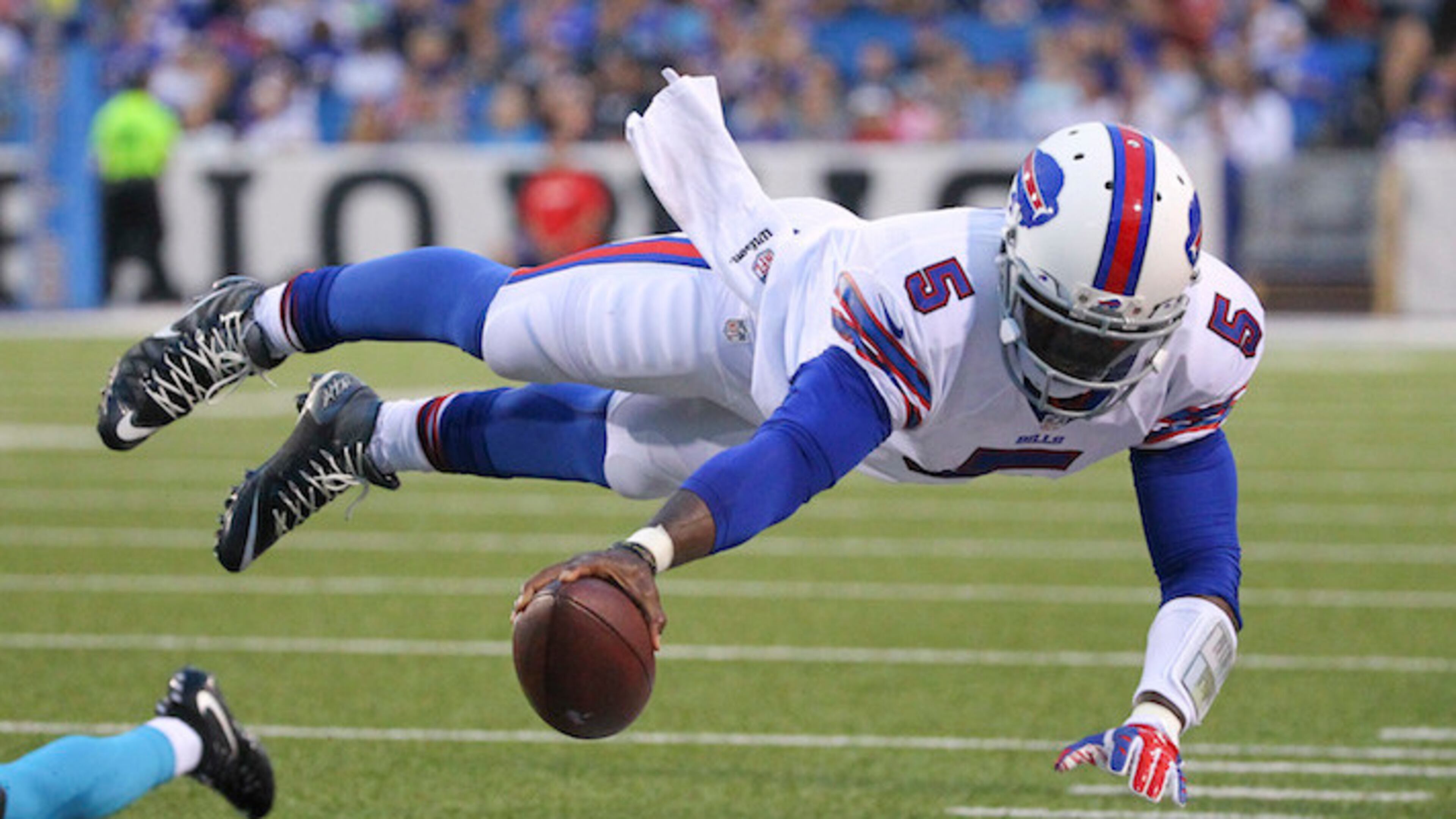 In this Aug. 15, 2015 file photo, Buffalo Bills quarterback Tyrod Taylor (5) dives for the first down marker during the first half of an NFL preseason football game against the Carolina Panthers in Orchard Park, N.Y. (AP Photo/Bill Wippert, File)