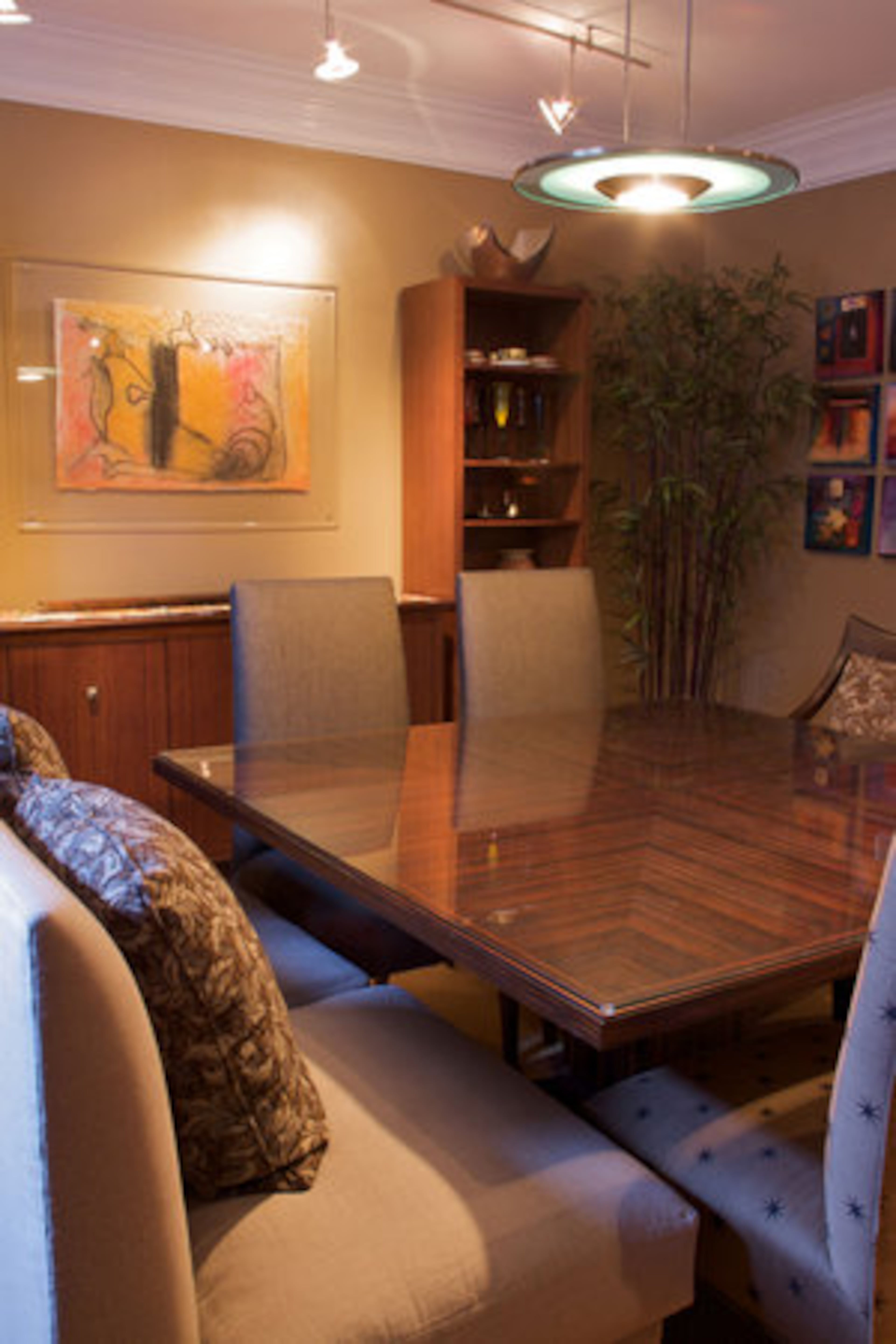 "Our square table has rich textures. When we have guests, the shape allows people to always be included in the conversation, unlike long rectangular dining room tables," Dr. Miles Graivier says.