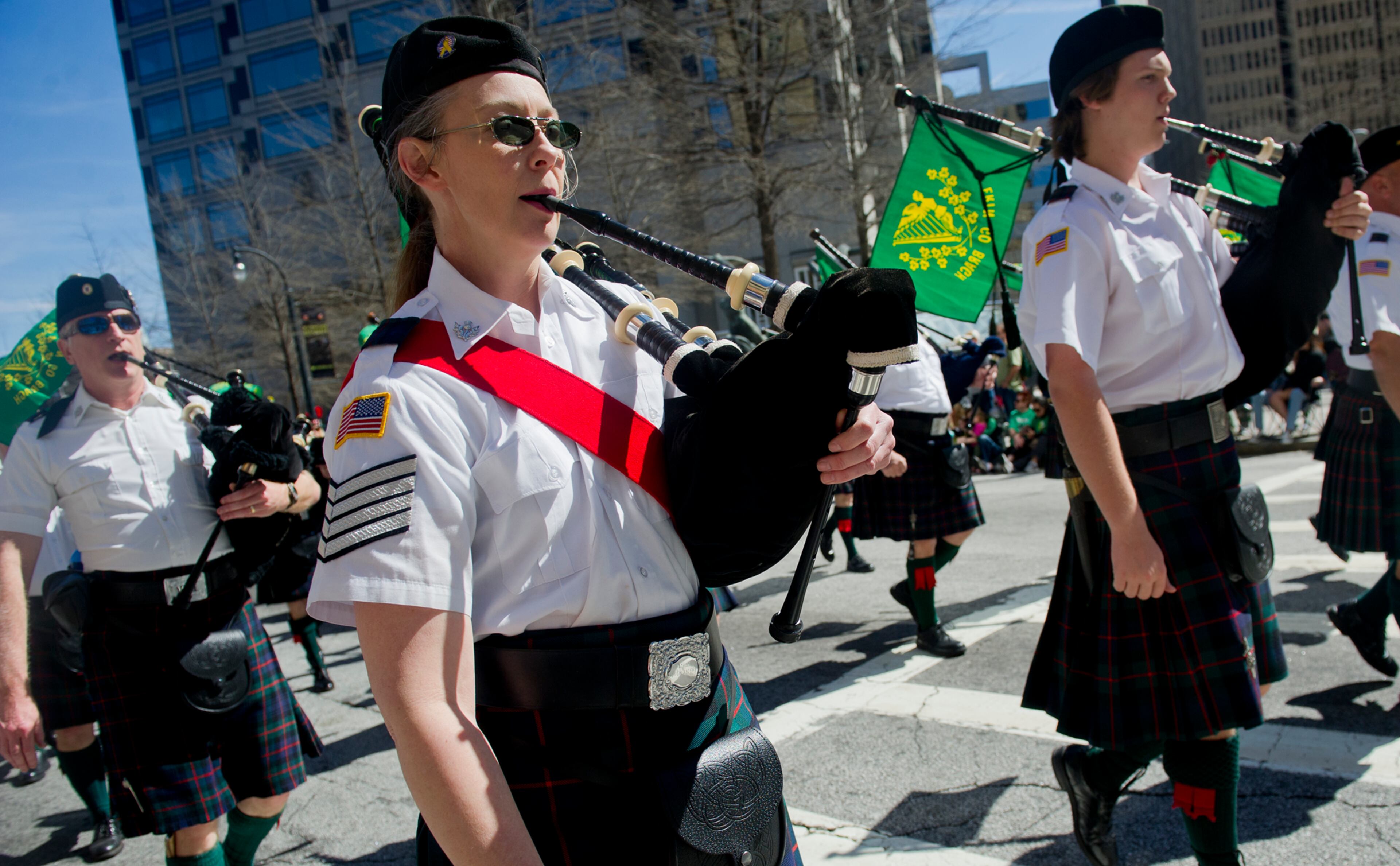 Lisa Wight holds her bagpipe as she marches down Peachtree Street during the 131st Atlanta St. Patrick's Day Parade on Saturday March 16, 2013. Close to 2,000 people marched in the parade which was viewed by over 80,000 attendees.