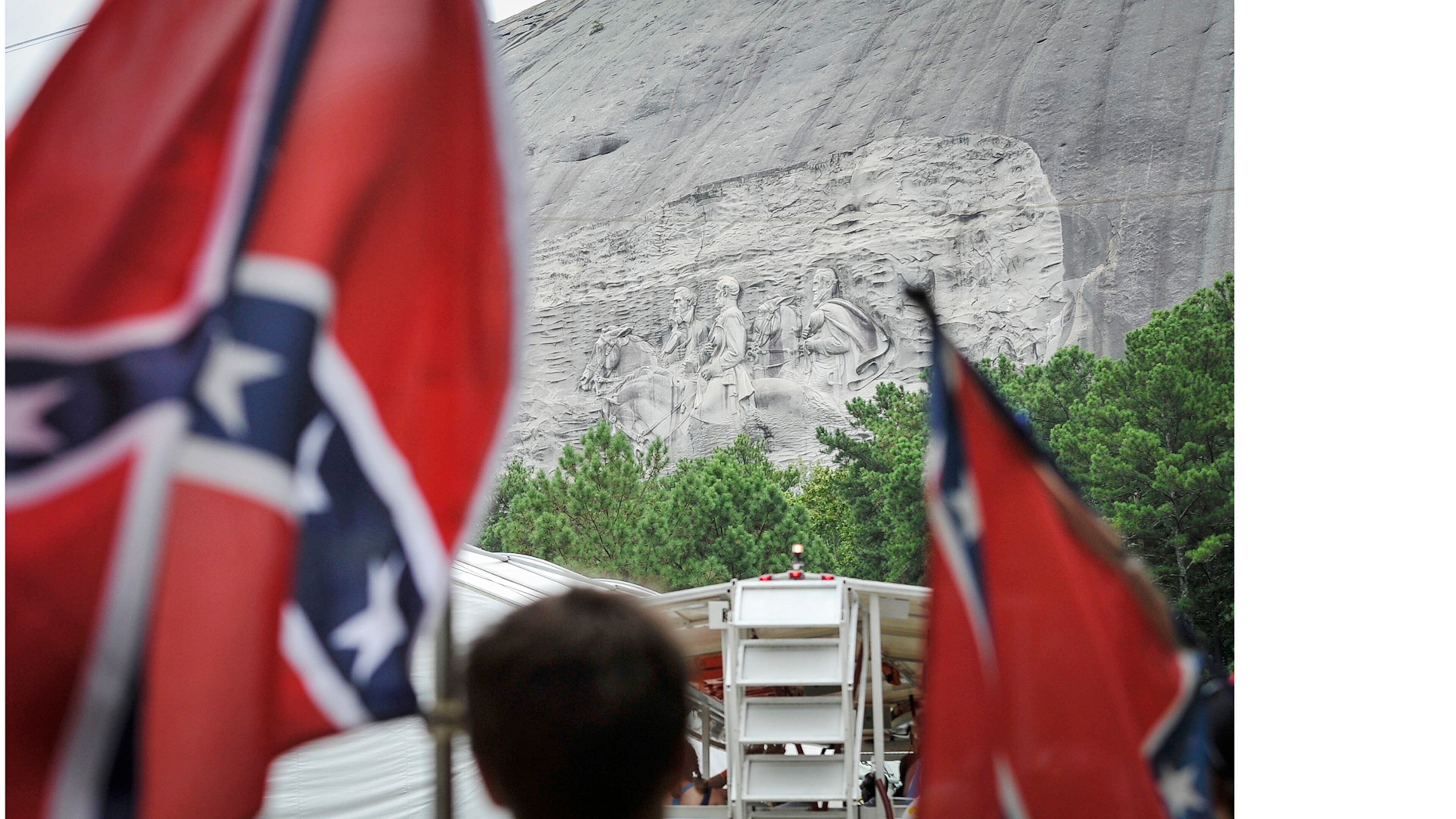 Confederate flag sympathizers marched past the carved monument on their way to the top of Stone Mountain earlyer this month.