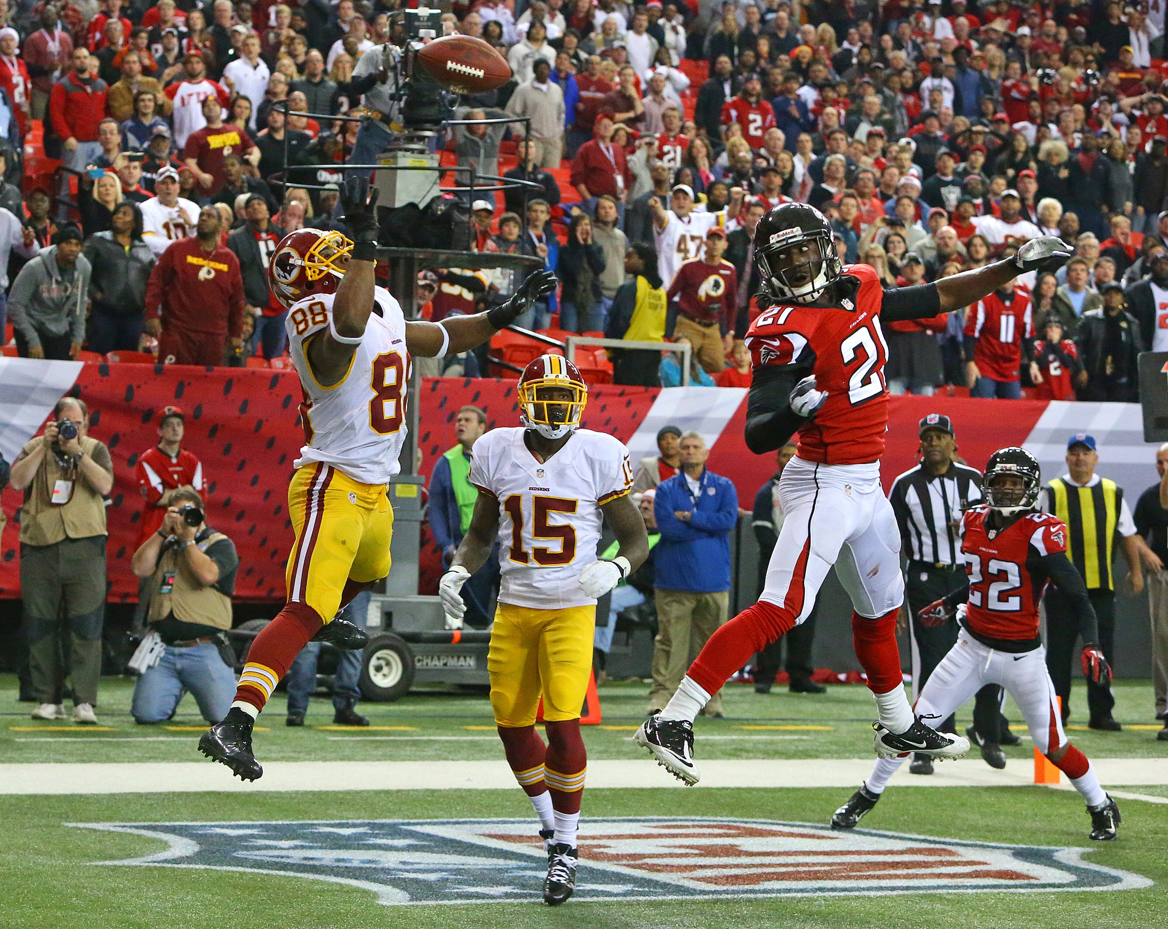 Atlanta Falcons cornerback Desmond Trufant tips the ball away from Washington Redskins wide receiver Pierre Garcon breaking up a 2-point conversion attempt by the Redskins during the last minute of a NFL football game on Sunday, Dec. 15, 2013, in Atlanta. The Falcons took over running out the clock to hold on to a 27-26 victory over the Redskins.