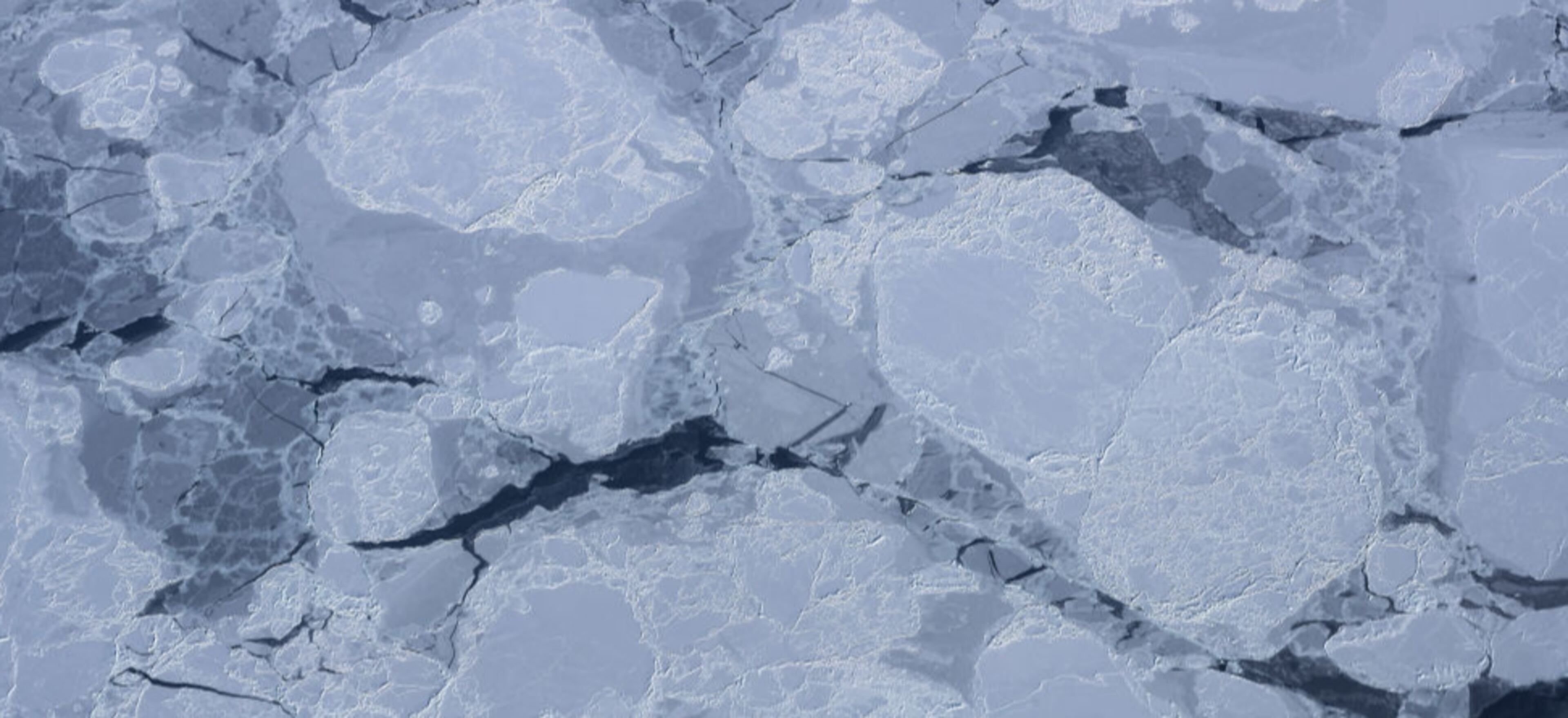 ELLESMERE ISLAND, CANADA - MARCH 29: Sea ice is seen from NASA's Operation IceBridge research aircraft on March 29, 2017 above Ellesmere Island, Canada. The ice fields of Ellesmere Island are retreating due to warming temperatures. NASA's Operation IceBridge has been studying how polar ice has evolved over the past nine years and is currently flying a set of eight-hour research flights over ice sheets and the Arctic Ocean to monitor Arctic ice loss aboard a retrofitted 1966 Lockheed P-3 aircraft. According to NASA scientists and the National Snow and Ice Data Center (NSIDC), sea ice in the Arctic appears to have reached its lowest maximum wintertime extent ever recorded on March 7. Scientists have said the Arctic has been one of the regions hardest hit by climate change. (Photo by Mario Tama/Getty Images)