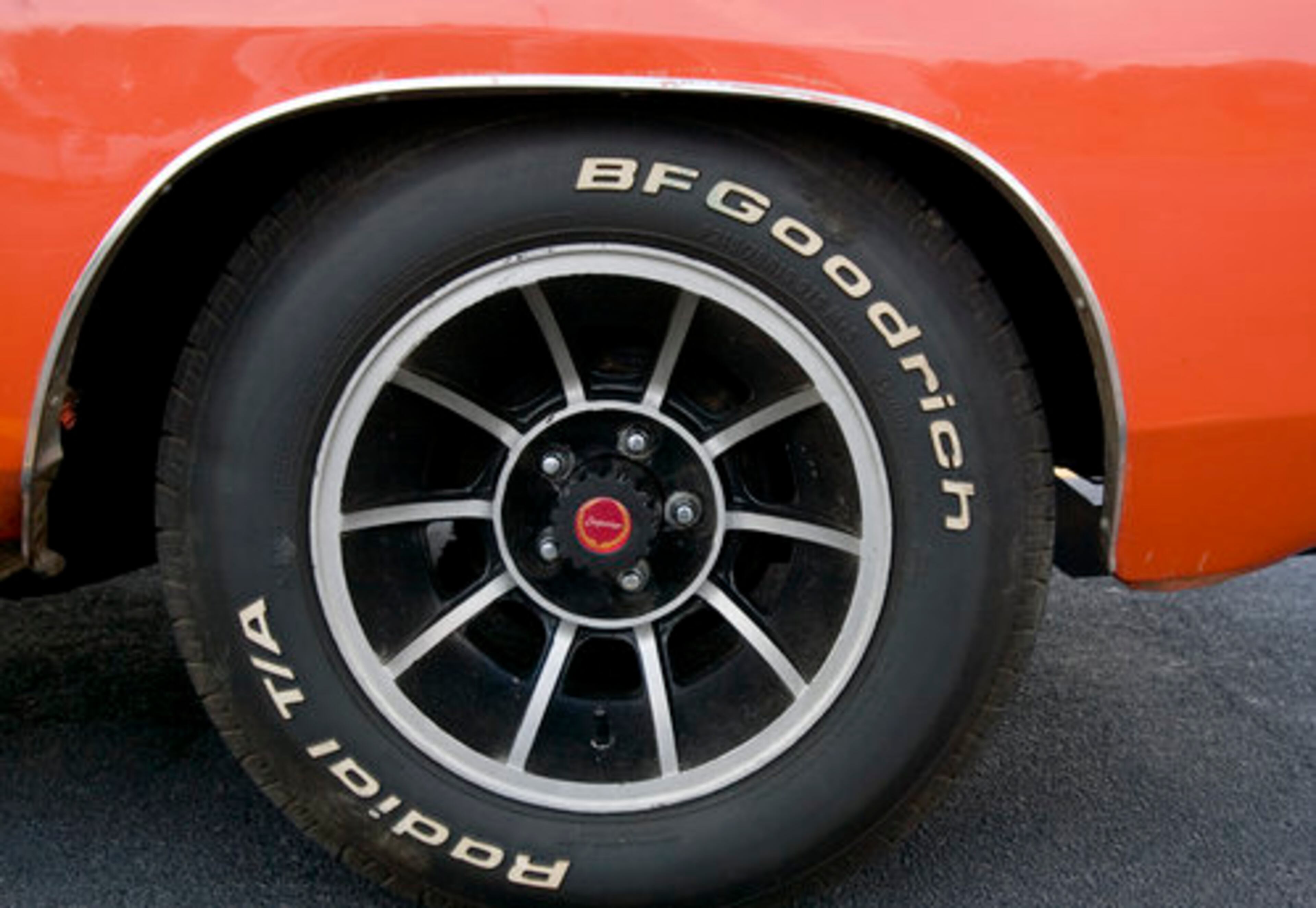 The raised white letter tires, blackout mag wheels and orange paint scheme usually draw a crowd.