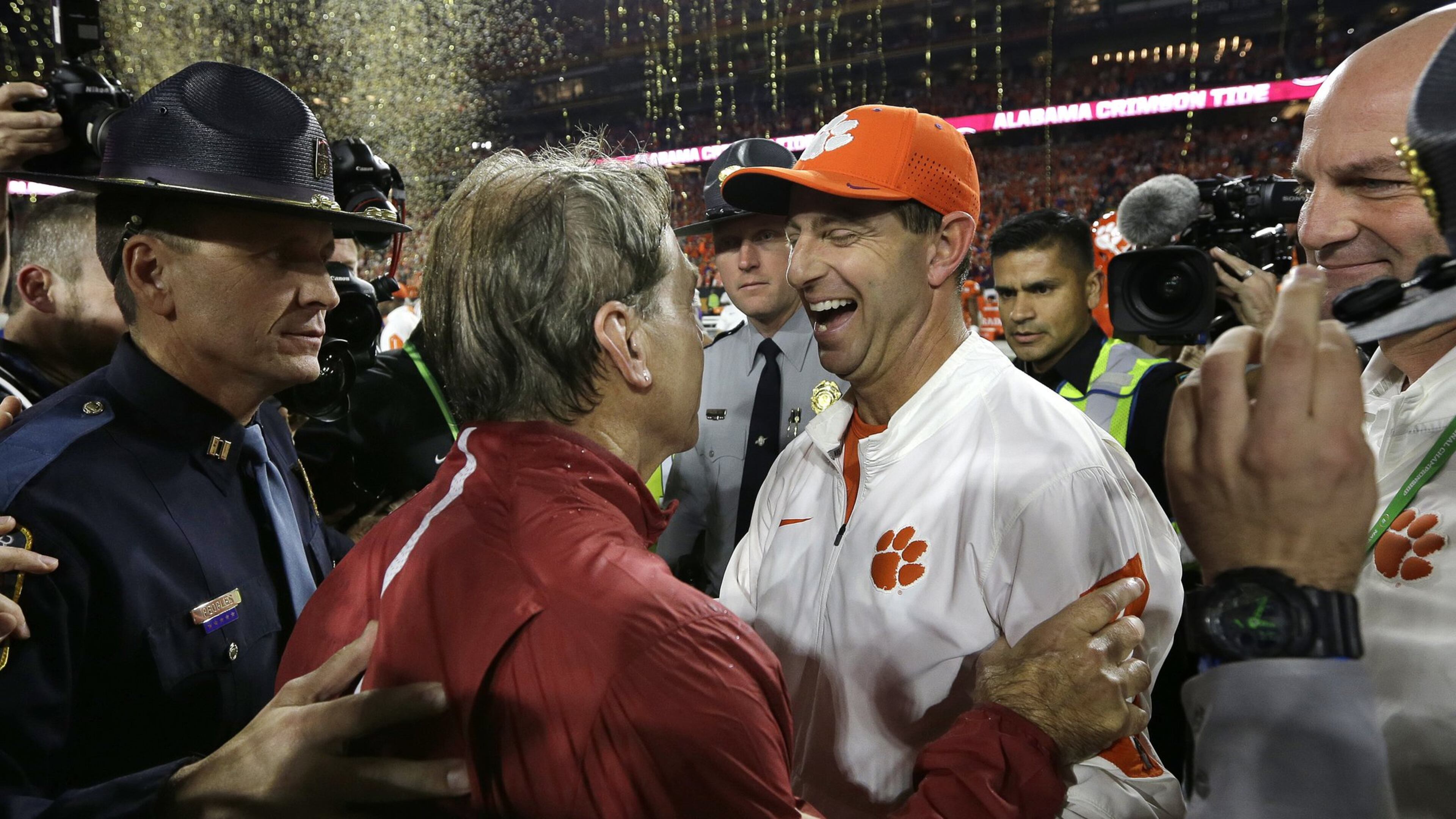 Even after last season’s wrenching 45-40 national championship loss, Clemson’s Dabo Swinney manages a big smile while congratulating Alabama’s Nick Saban. (AP Photo/David J. Phillip, File)