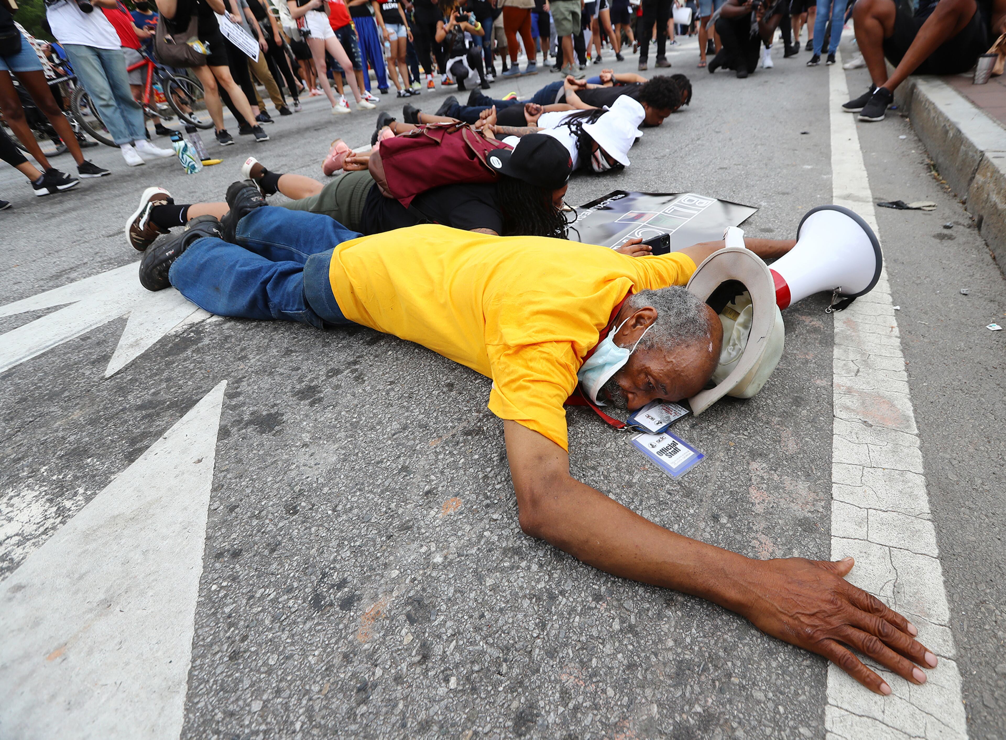 060320 Atlanta: Nathan Knight, President DeKalb County SCLC, joins the protesters who say they canâÃôt breath on Marietta Street at Centennial Olympic Park Drive outside the CNN Center at Olympic Park during a sixth day of protests over the death of George Floyd in Minneapolis police custody on Wednesday, June 3, 2020, in Atlanta. Curtis Compton ccompton@ajc.com