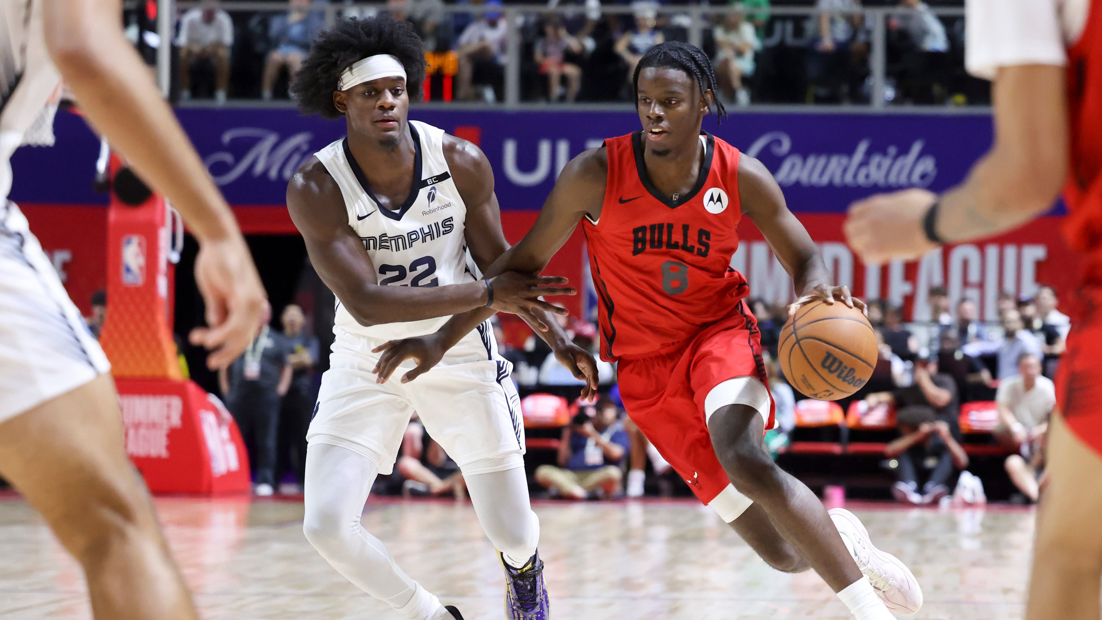 Bulls forward Caleb Wilson (right) drives against Grizzlies forward Taylor Hendricks during their NBA Summer League basketball game Friday, July 10, 2026, in Las Vegas. (Ian Maule/AP)