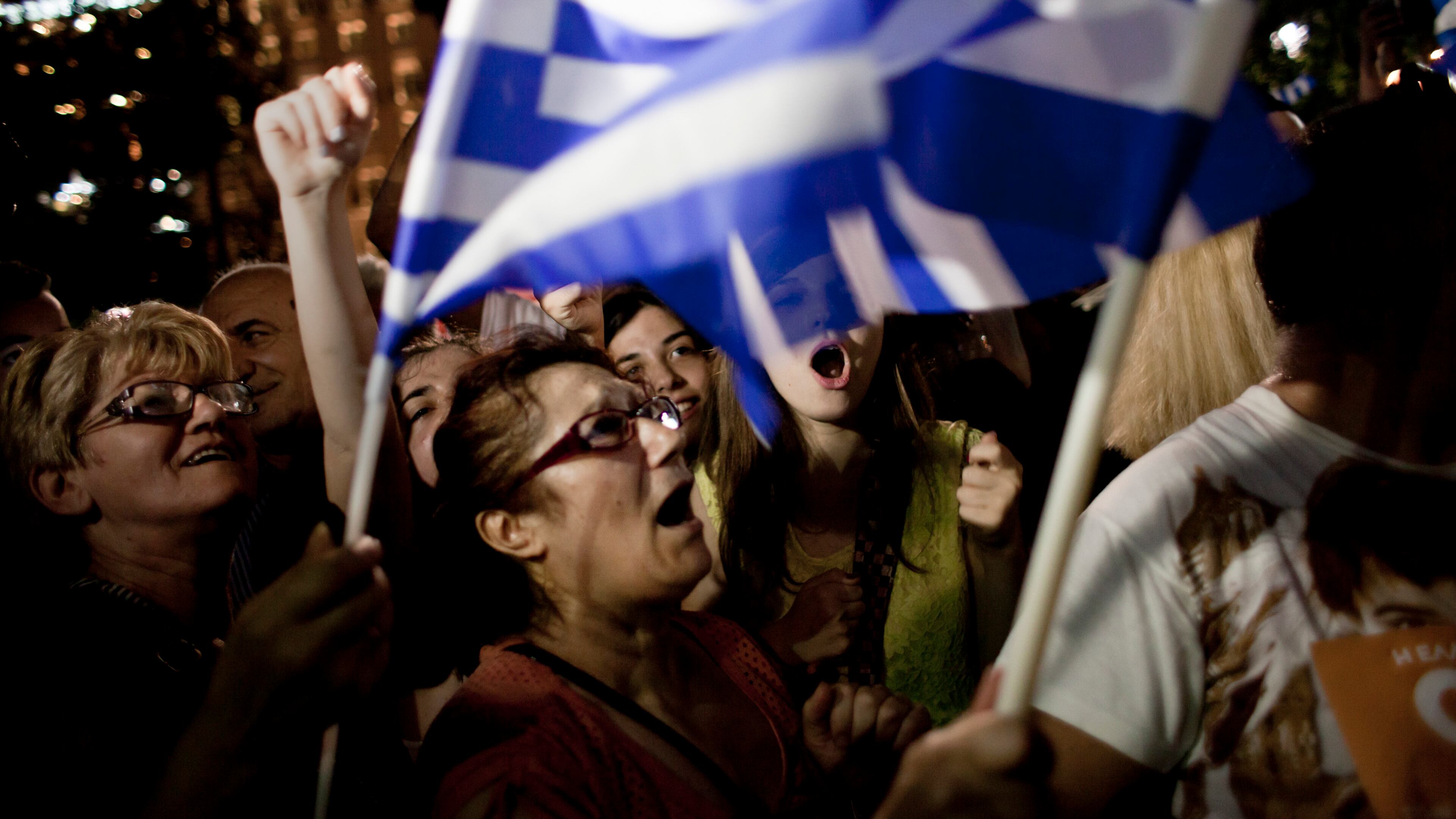 People celebrate the outcome of the bailout deal referendum at Syntagma Square in Athens, Greece, July 5. (Eirini Vourloumis / The New York Times)