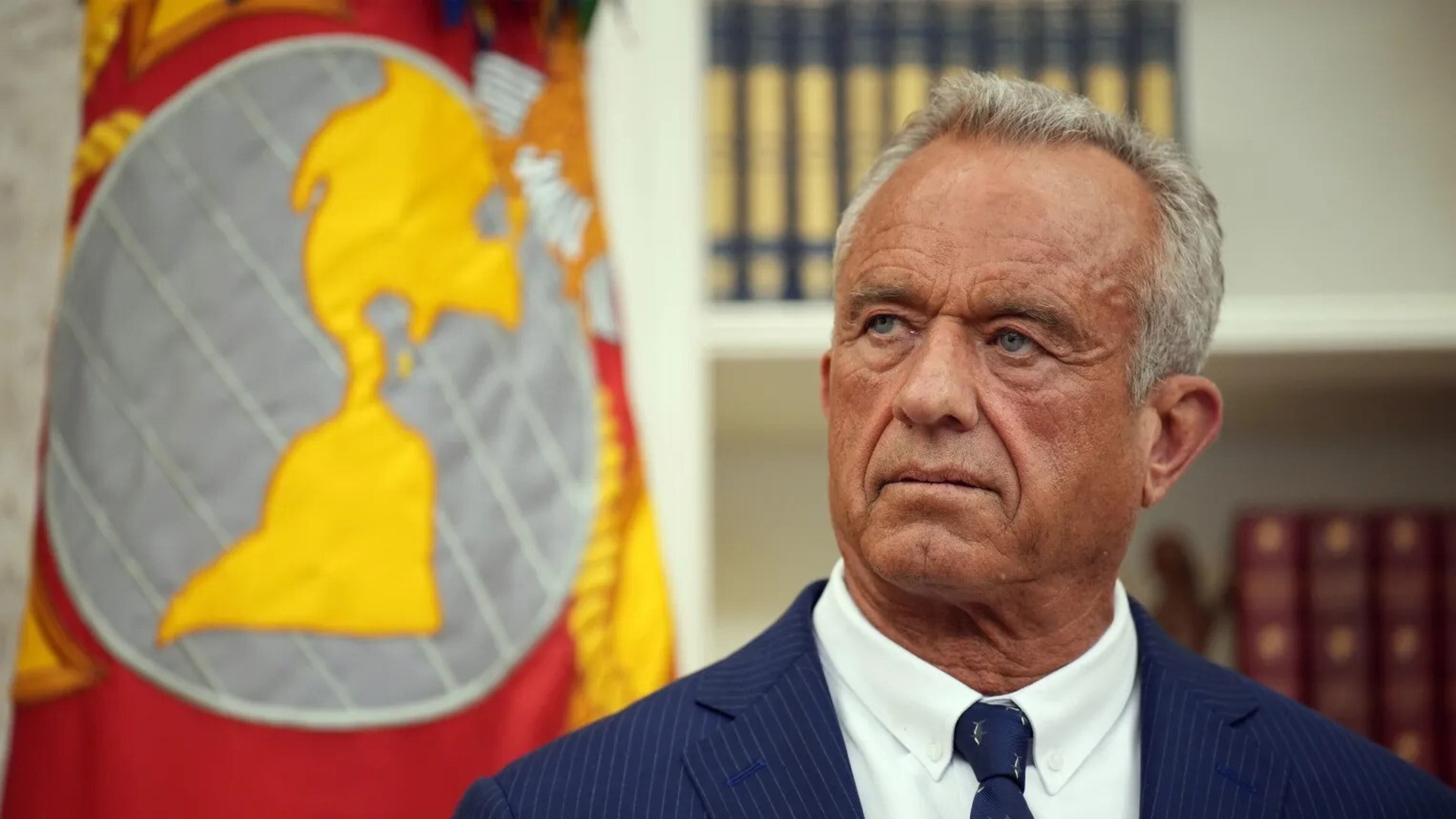 Robert F. Kennedy Jr. listens before being sworn in as secretary of Health and Human Services on Feb. 13. (Andrew Harnik/Getty Images)