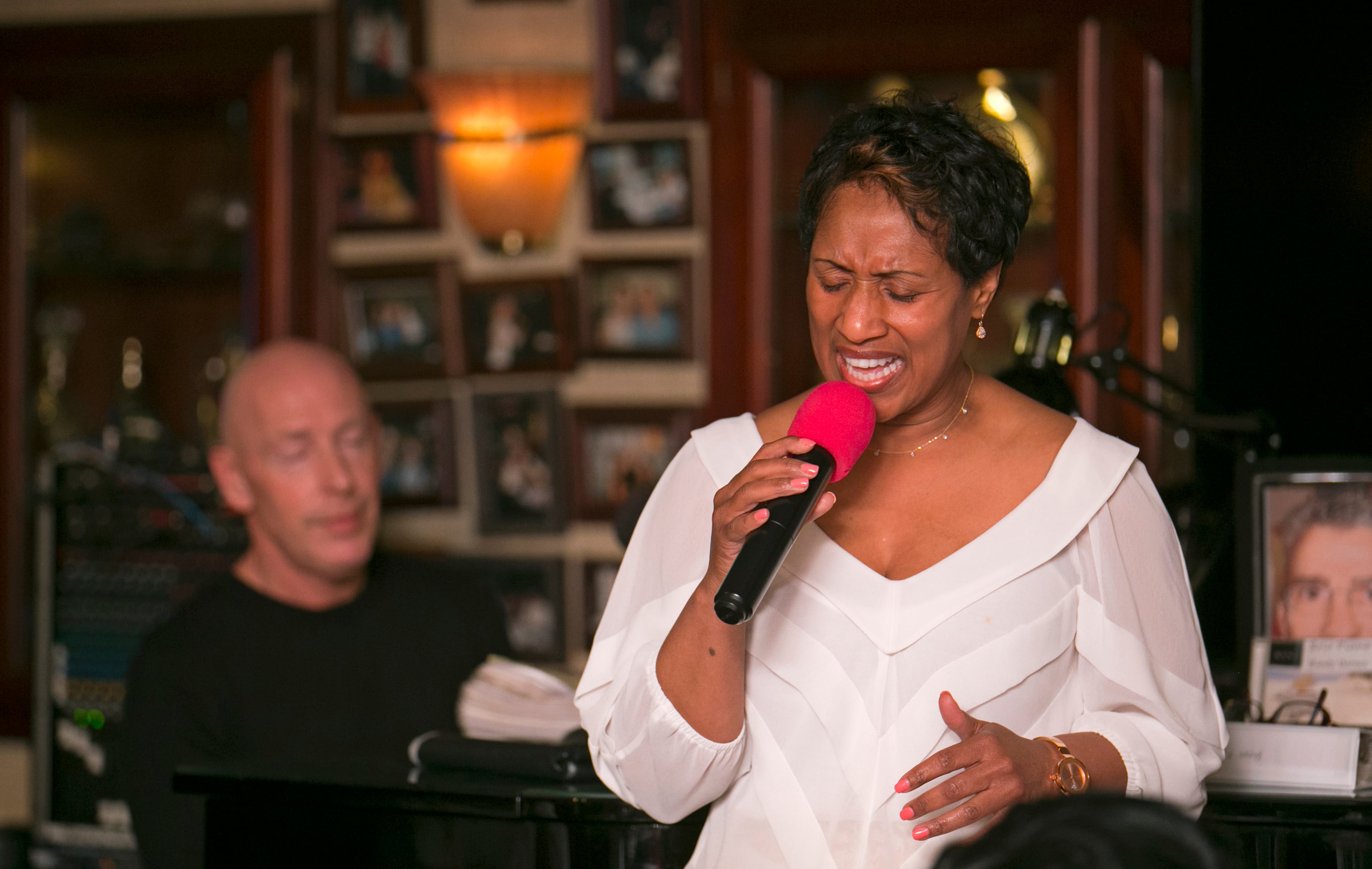 April 7, 2016 - Johns Creek, Ga: Casey Black sings for customers at Altobeli's Restaurant and Piano Bar Thursday, April 7, 2016, in Johns Creek, Ga. Also pictured is piano player Randy Barnes, at left. Altobeli's Restaurant and Piano Bar is an Italian neighborhood restaurant that's served the community for over 25 years. This is for the insider's guide feature about the Newtown neighborhood. PHOTO / JASON GETZ