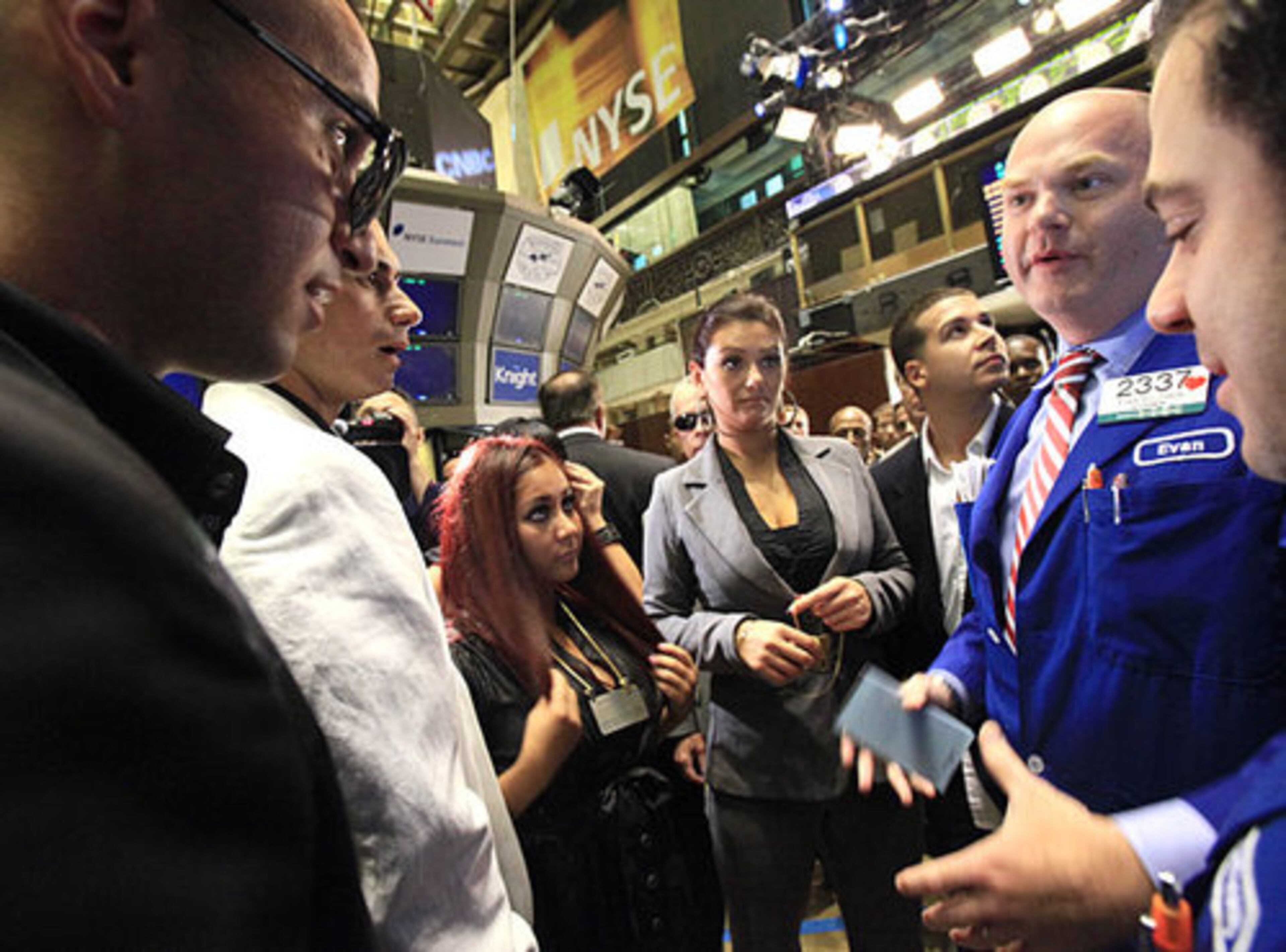 "The Situation," "Pauly D," "Snooki," "J-Woww" and Vinny visit with specialist Evan Solomon, second from right, at the post that trades Viacom shares after participating in opening bell ceremonies