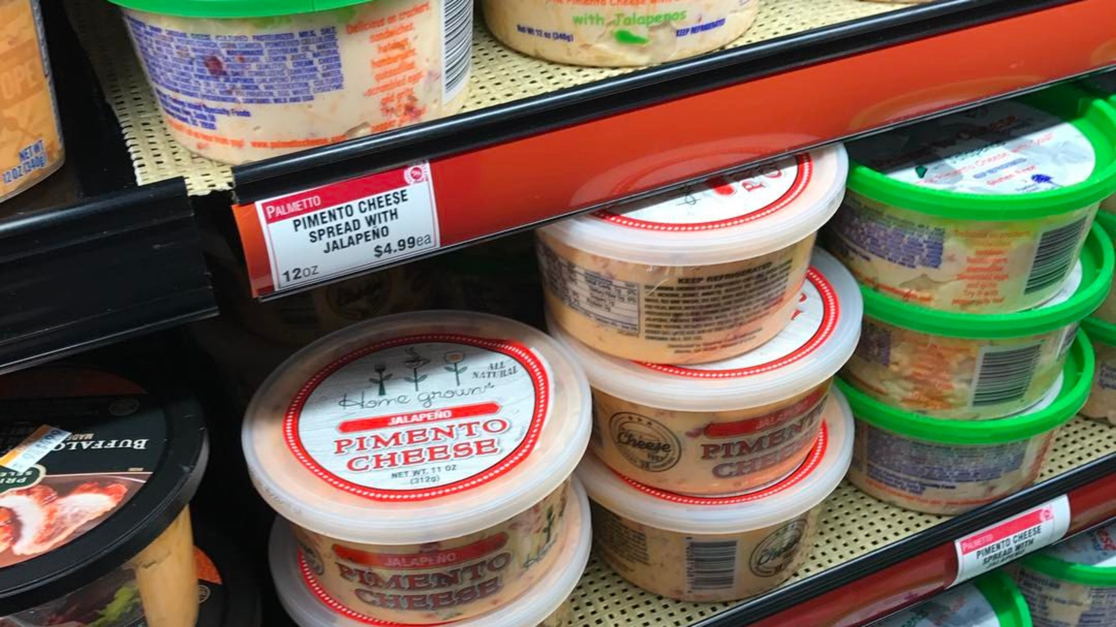 Home Grown’s packaged pimento cheese is shown on the shelves of a Kroger grocery store.