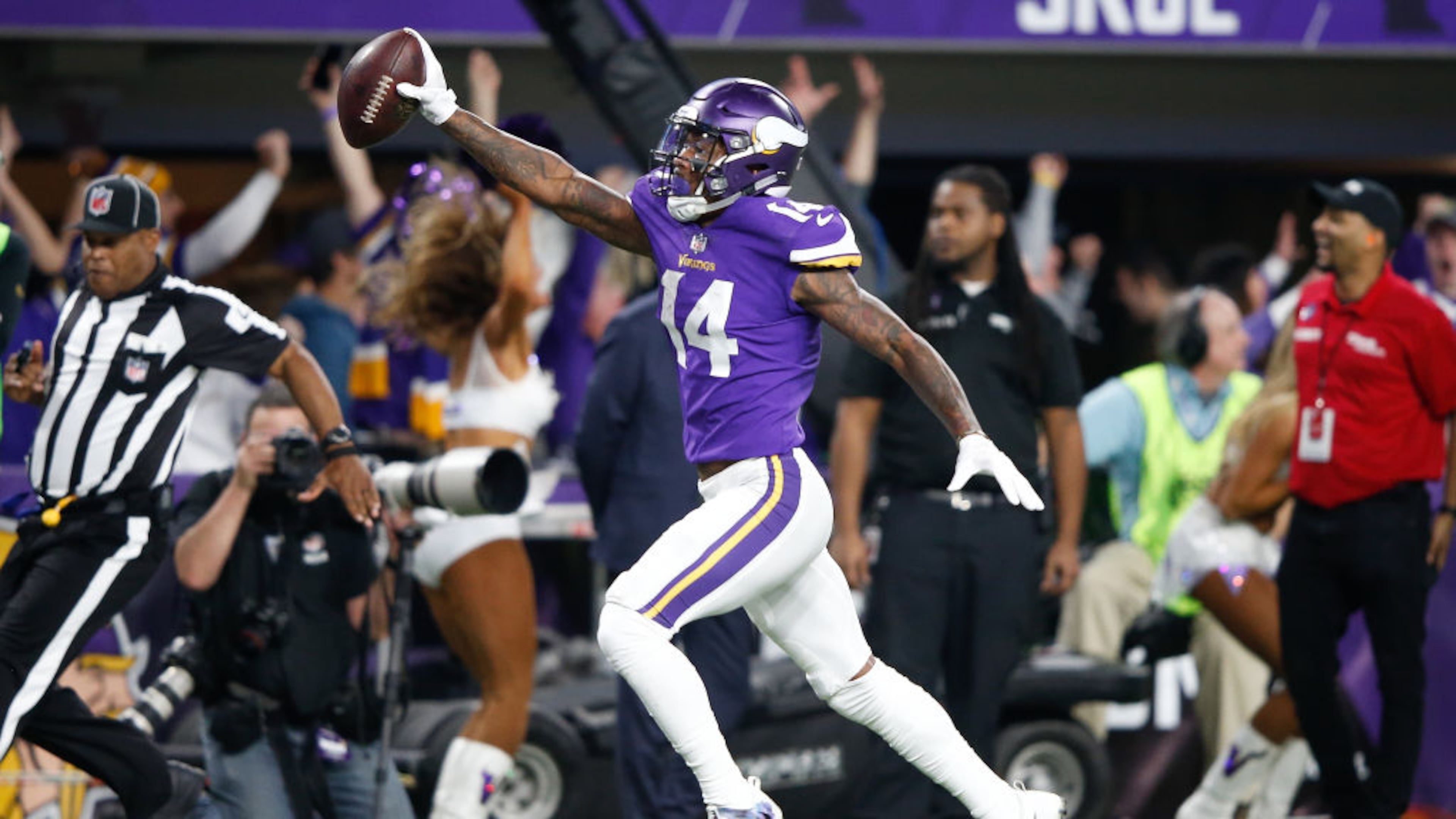 Stefon Diggs (14) of the Minnesota Vikings scores a game-winning touchdown as time expires against the New Orleans Saints during Sunday's NFC Divisional Playoff game at U.S. Bank Stadium in Minneapolis.