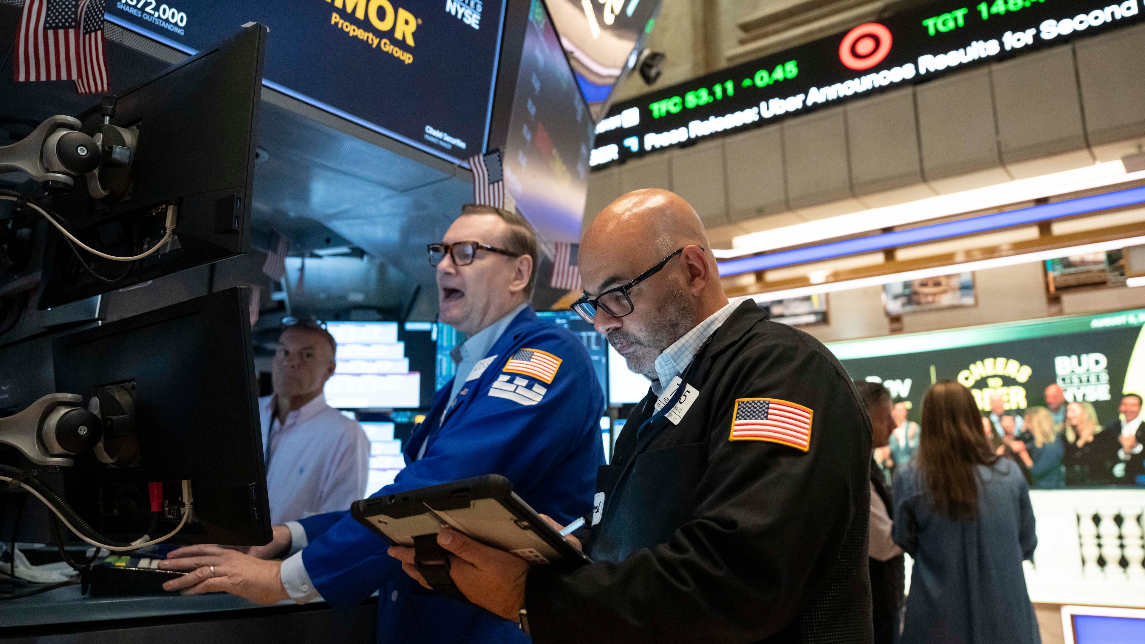 Trader Fred Demarco, right, and Specialist Patrick King, left, work on the floor of the New York Stock Exchange, Wednesday, Aug.. 5, 2026, in New York. (AP Photo/Yuki Iwamura)