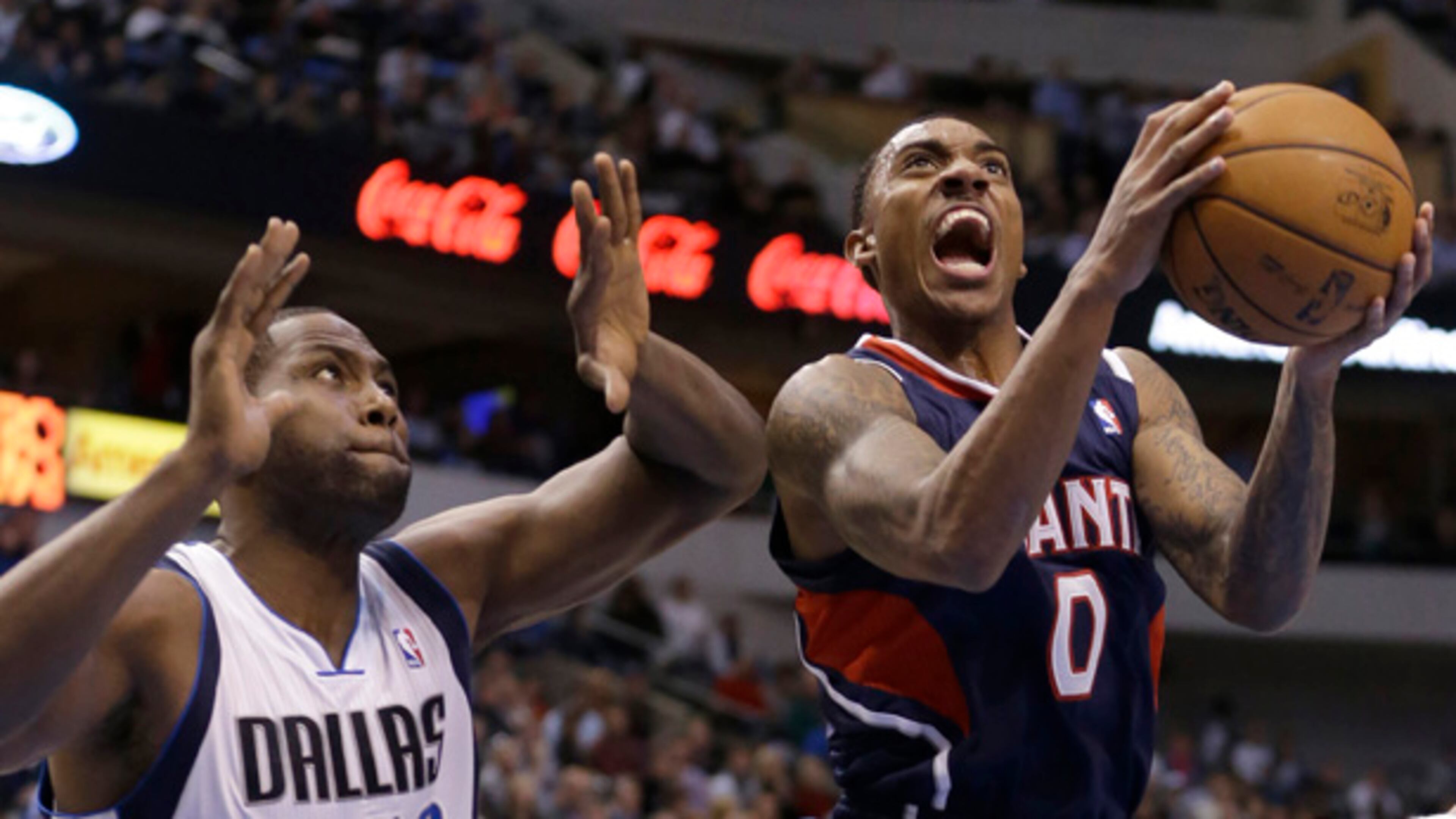 Atlanta Hawks guard Jeff Teague (0) drives to score past Dallas Mavericks forward Elton Brand (42) during the first half of an NBA basketball game, Monday, Feb. 11, 2013, in Dallas. (AP Photo/LM Otero)