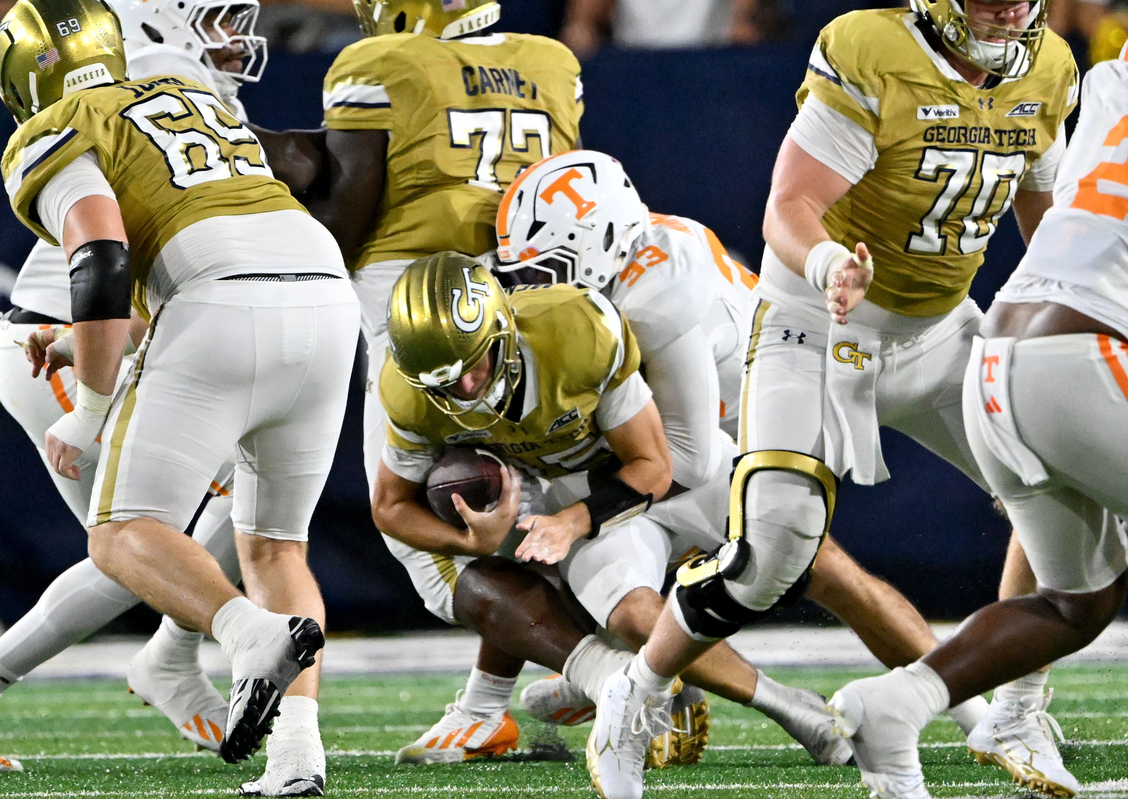Georgia Tech quarterback Alberto Mendoza (15) is sacked by Tennessee defensive lineman Jordan Norman (33) during the second half in an NCAA college football game at Bobby Dodd Stadium on Saturday, Sept. 12, 2026, in Atlanta. Tennessee defeated Georgia Tech 45-24. (Hyosub Shin/AJC)