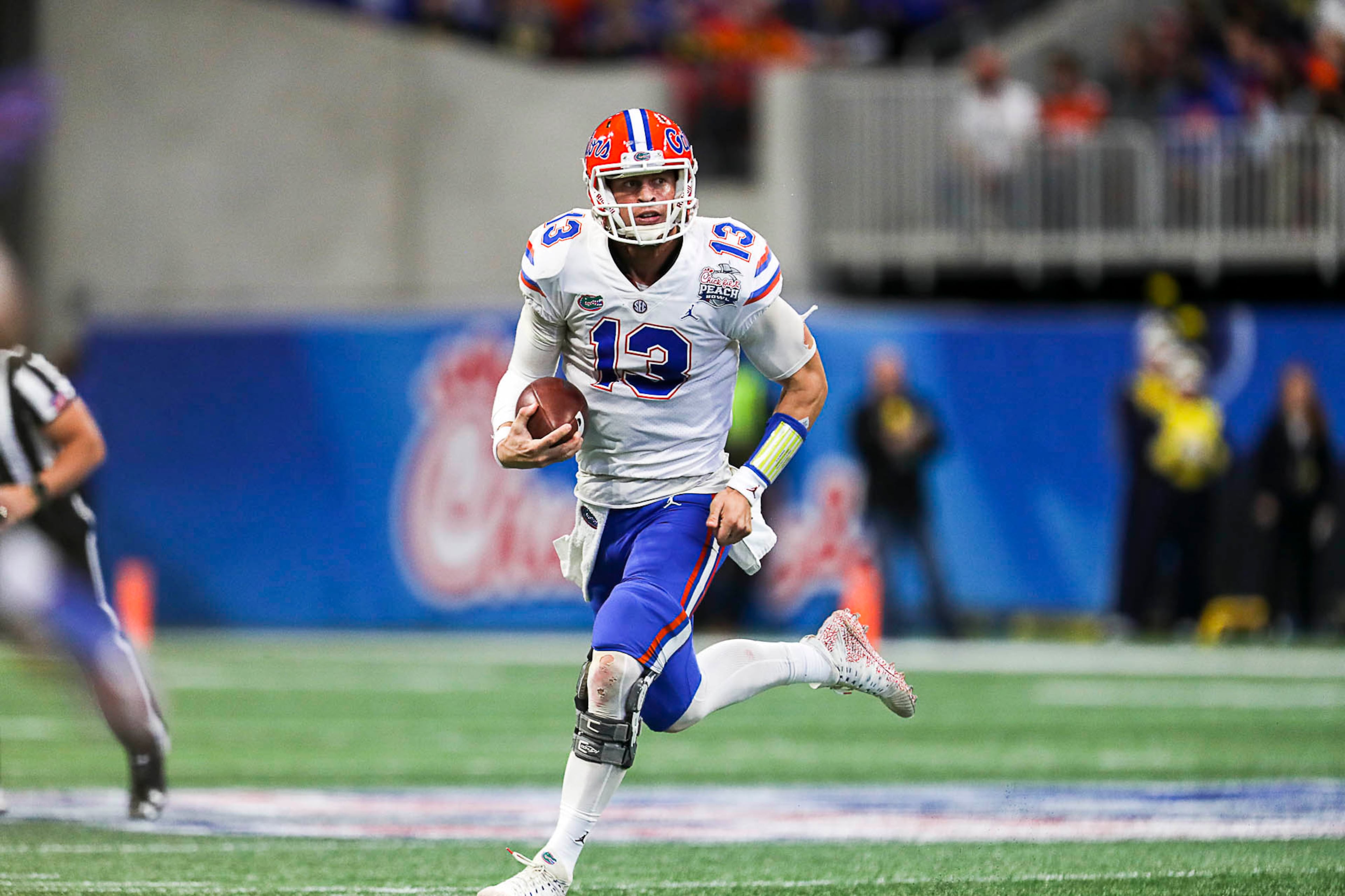 12/29/2018 -- Atlanta, Georgia -- Florida Gators quarterback Feleipe Franks (13) carries the ball for a gain of 15 yards during the first half of the Chick-fil-A Peach Bowl at Mercedes-Benz Stadium in Atlanta, Saturday, December 29, 2018. (ALYSSA POINTER/ALYSSA.POINTER@AJC.COM)