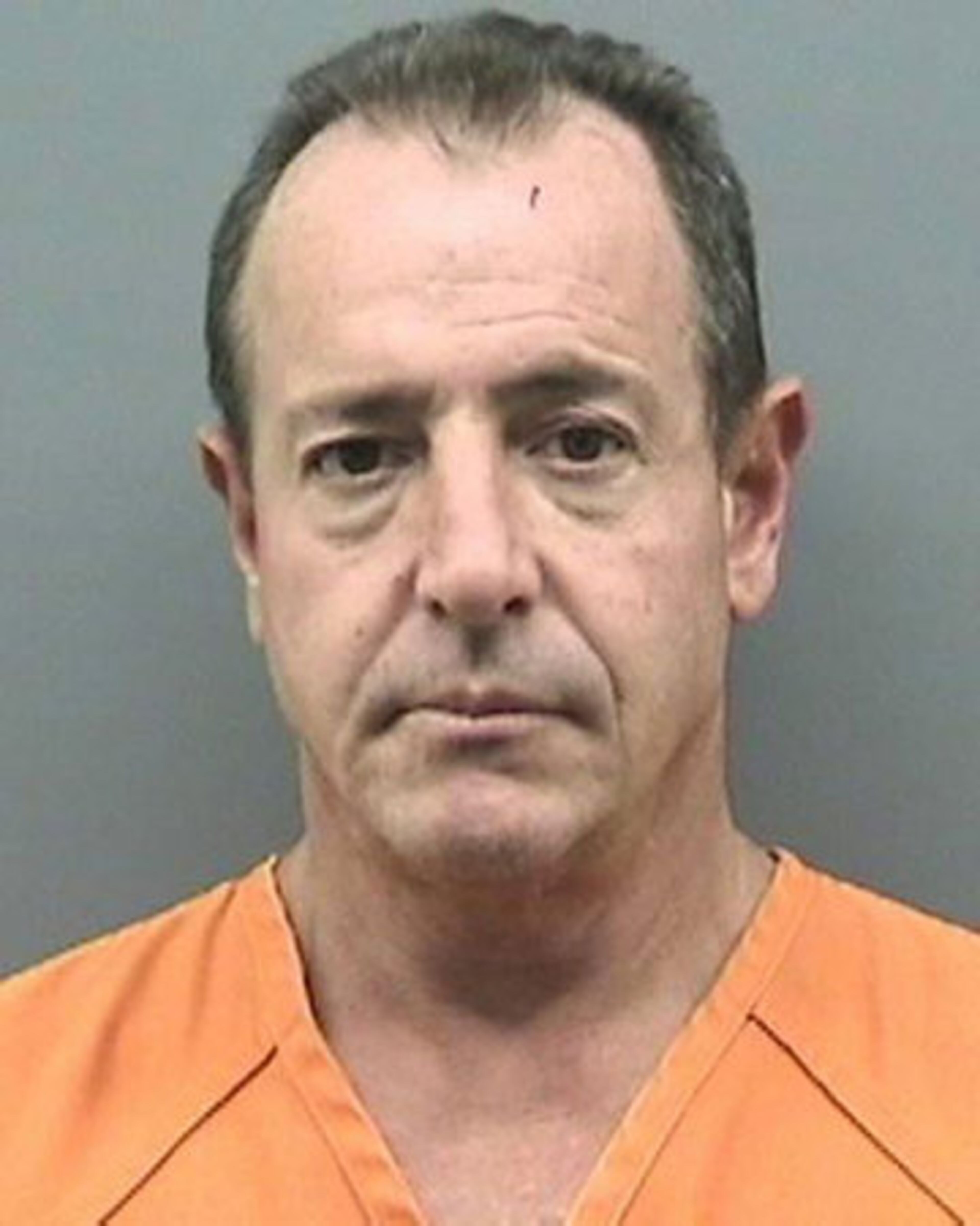 In this arrest photo made available by the Tampa Police Department, Michael Lohan is shown following his arrest, Tuesday Oct. 25, 2011 in Tampa, Fla.