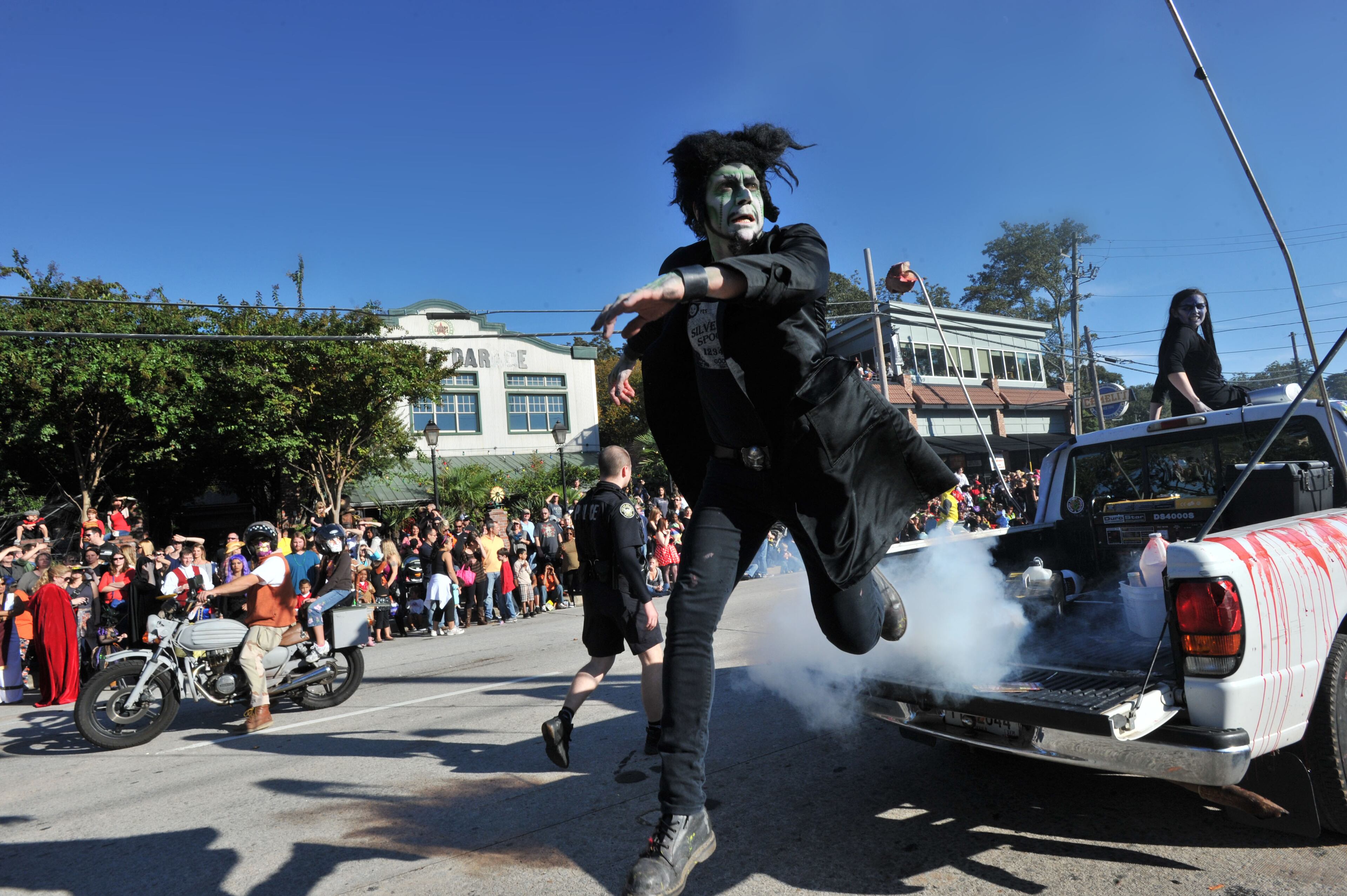 Beware of creatures jumping from small trucks at the Little Five Points Halloween Parade. This one comes courtesy of the Atlanta Zombie Apocalypse attraction.