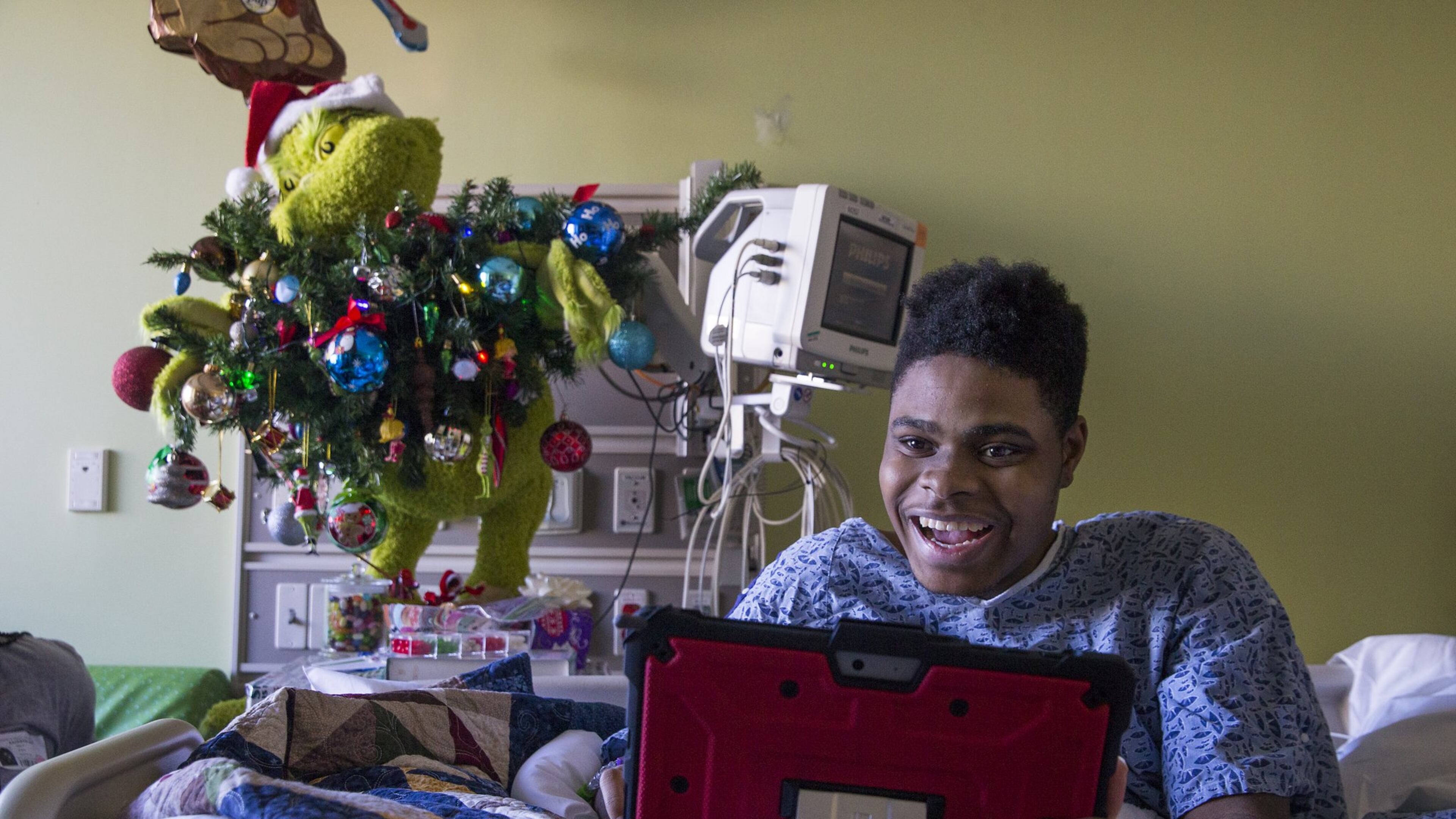 Patient Steffon Boyd, 17, of Dalton uses a tablet to control an OhmniLabs robot on his floor at the Children’s Healthcare of Atlanta at Scottish Rite on Dec. 19, 2019. Boyd uses the robot to interact with people and participate in group activities in the Child Life Zone Network at the hospital. (ALYSSA POINTER/ALYSSA.POINTER@AJC.COM)