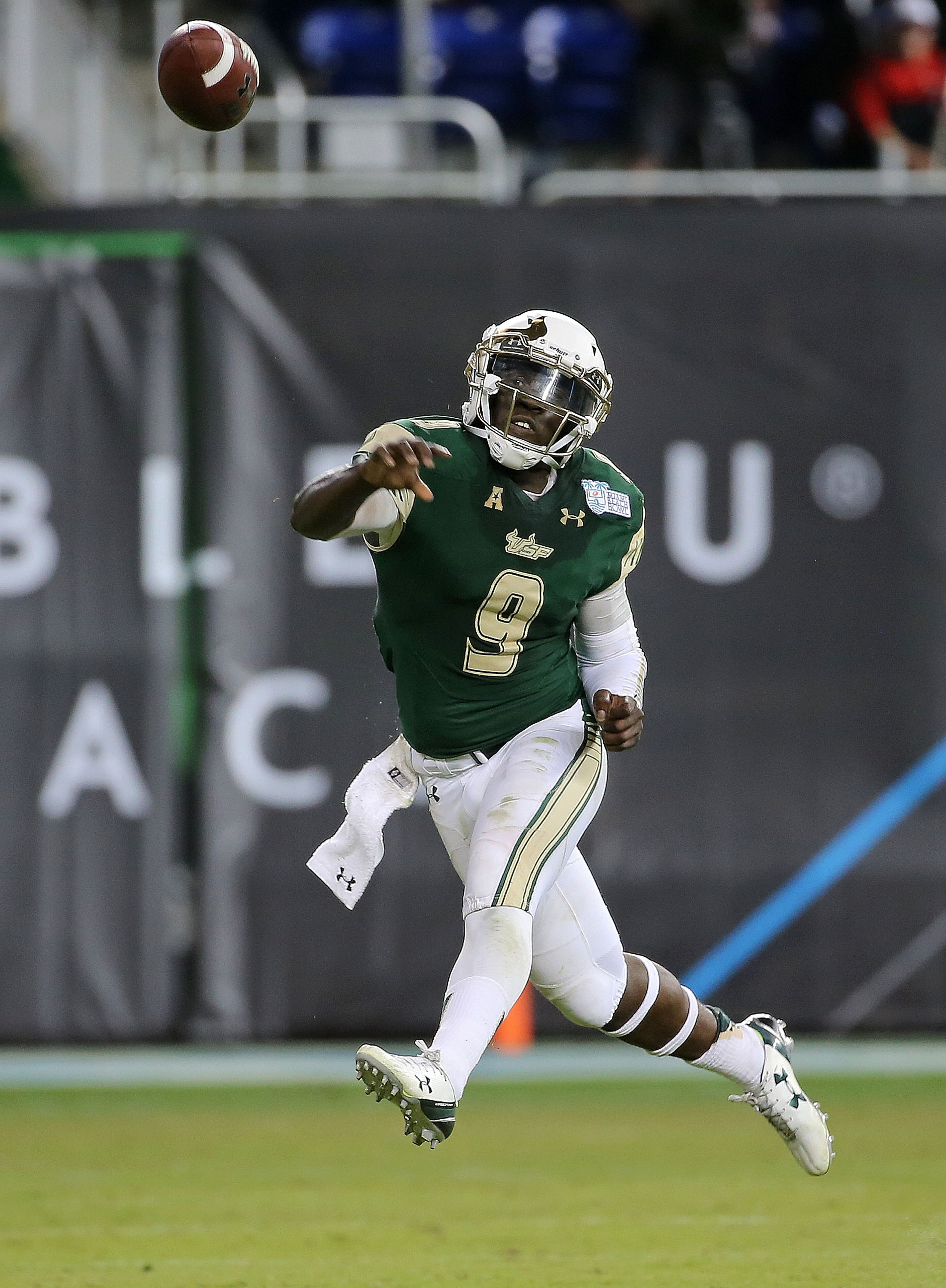MIAMI, FL - DECEMBER 21: Quinton Flowers #9 of the South Florida Bulls passes during the 2015 Miami Beach Bowl against the Western Kentucky Hilltoppers at Marlins Park on December 21, 2015 in Miami, Florida. (Photo by Mike Ehrmann/Getty Images)