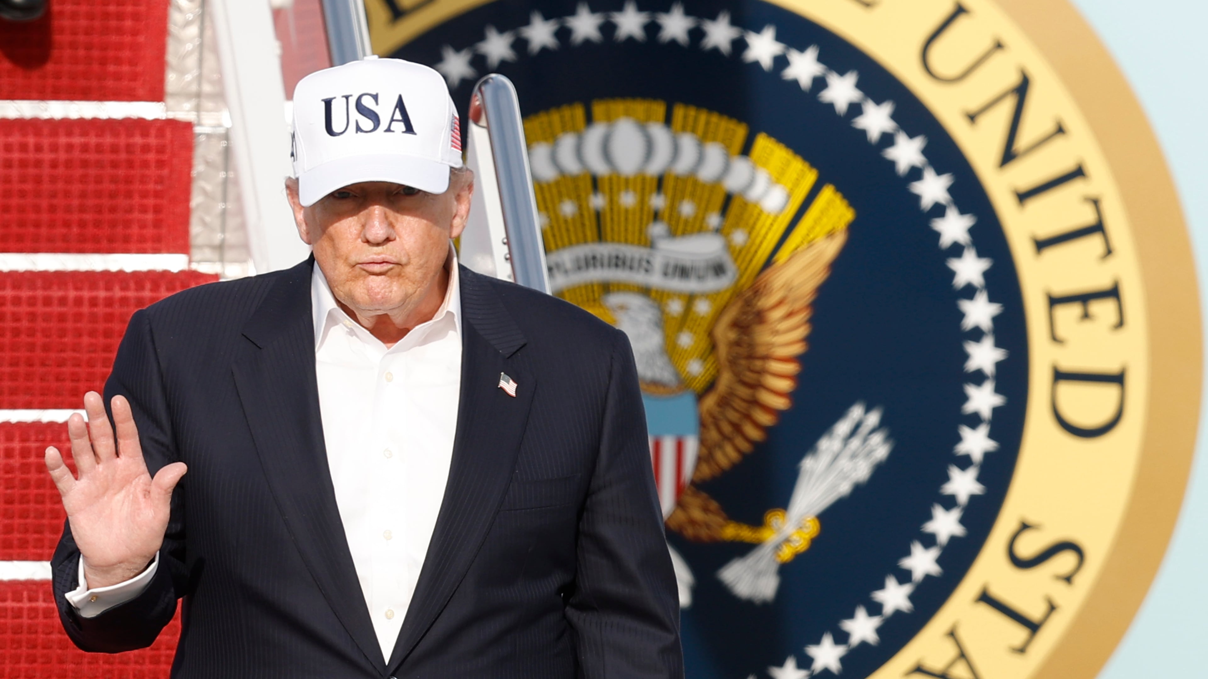 President Donald Trump walks down the stairs of Air Force One upon his arrival at Joint Base Andrews, Md., Friday, May 15, 2026. (AP Photo/Luis M. Alvarez)