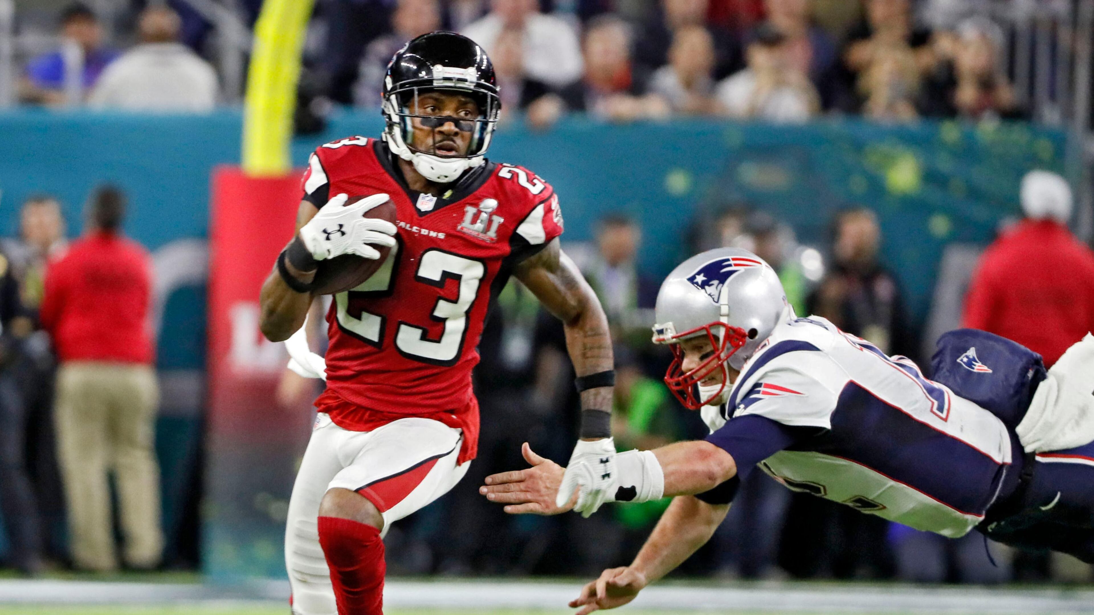 No. 4 -- Alford's pick 6: Patriots quarterback Tom Brady leaps in vain to try to stop Falcons cornerback Robert Alford after his interception. Bob Andres/AJC