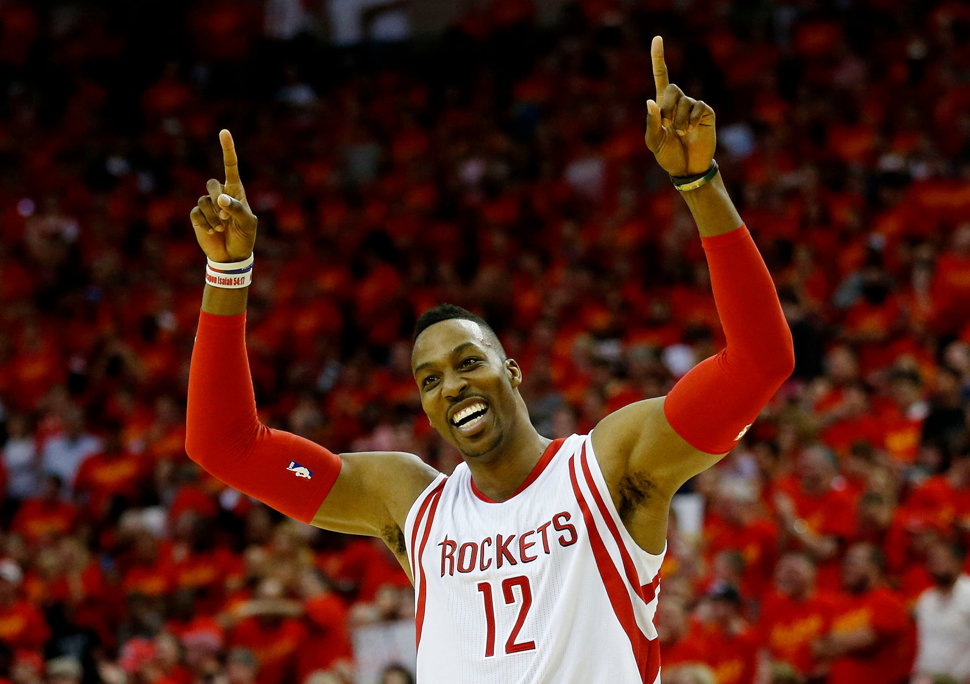 Dwight Howard #12 of the Houston Rockets celebrates after his team defeated the Los Angeles Clippers 113 to 100 during Game Seven of the Western Conference Semifinals in the 2015 NBA Playoffs at the Toyota Center on May 17, 2015 in Houston, Texas. (Photo by Scott Halleran/Getty Images)