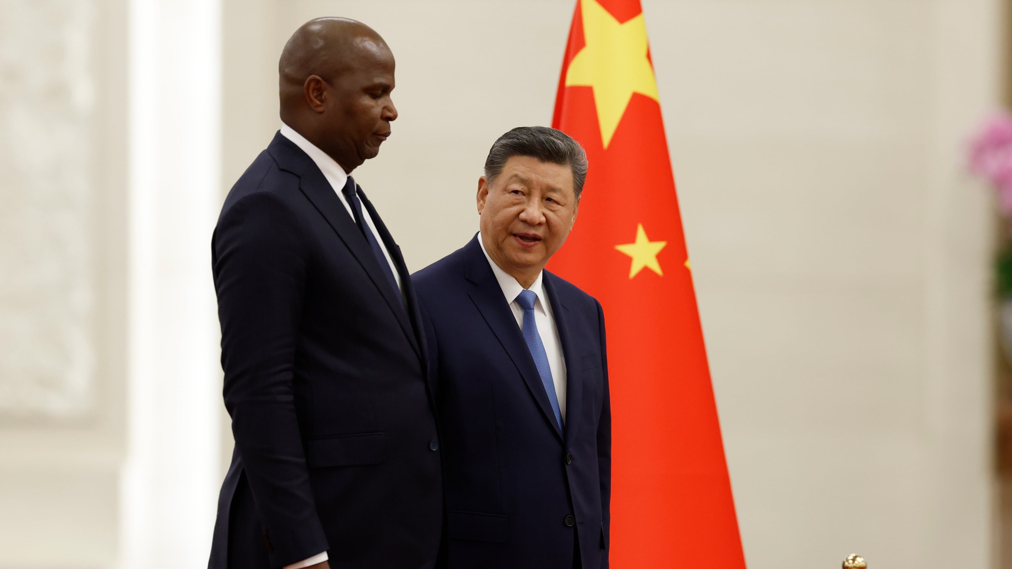China's President Xi Jinping, right, and Mozambique's President Daniel Chapo attend a welcoming ceremony at the Great Hall of the People in Beijing Tuesday, April 21, 2026. (Haruna Furuhashi/Pool Photo via AP)