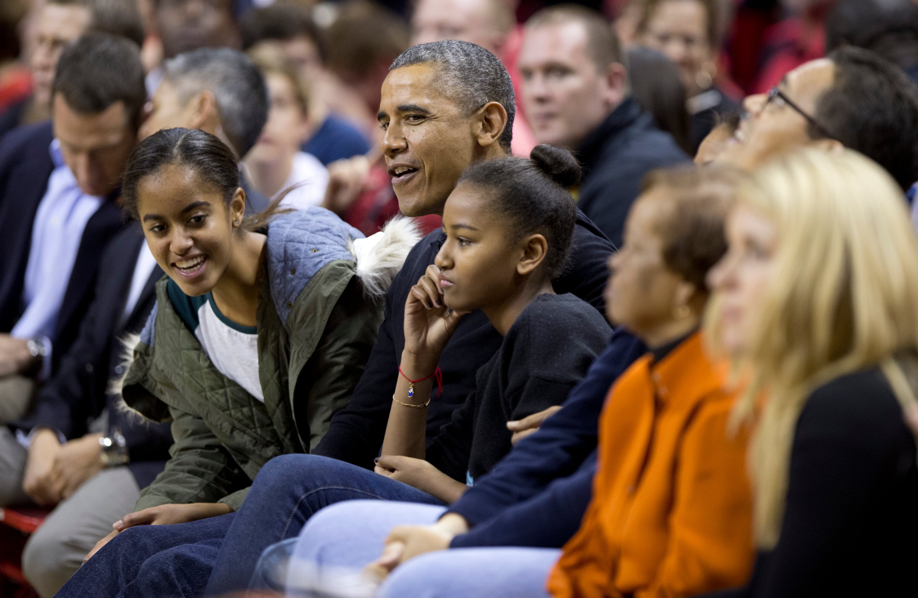 President Barack Obama and his daughters Malia, left, Sasha, third from left, and mother-in-law Marian Robinson, second from right.