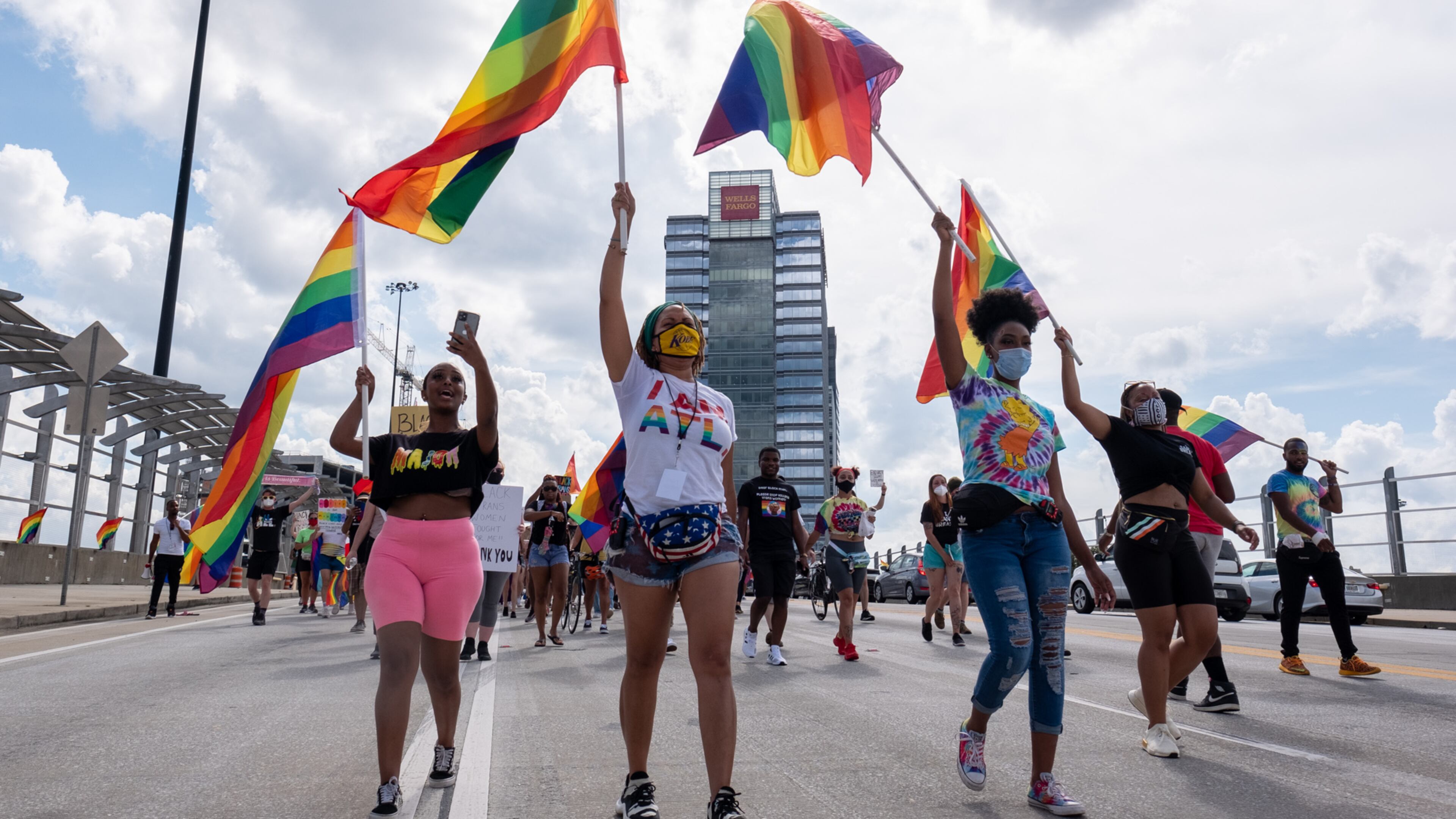 FILE: Dee Dee Tsegaye, from left, Andané Browne and Destiny Britt lead the Beauty In Colors Rally and march across the 17th Street bridge on June 28, 2020. (Photo Courtesy of Ben Gray/Atlanta Journal-Constitution)