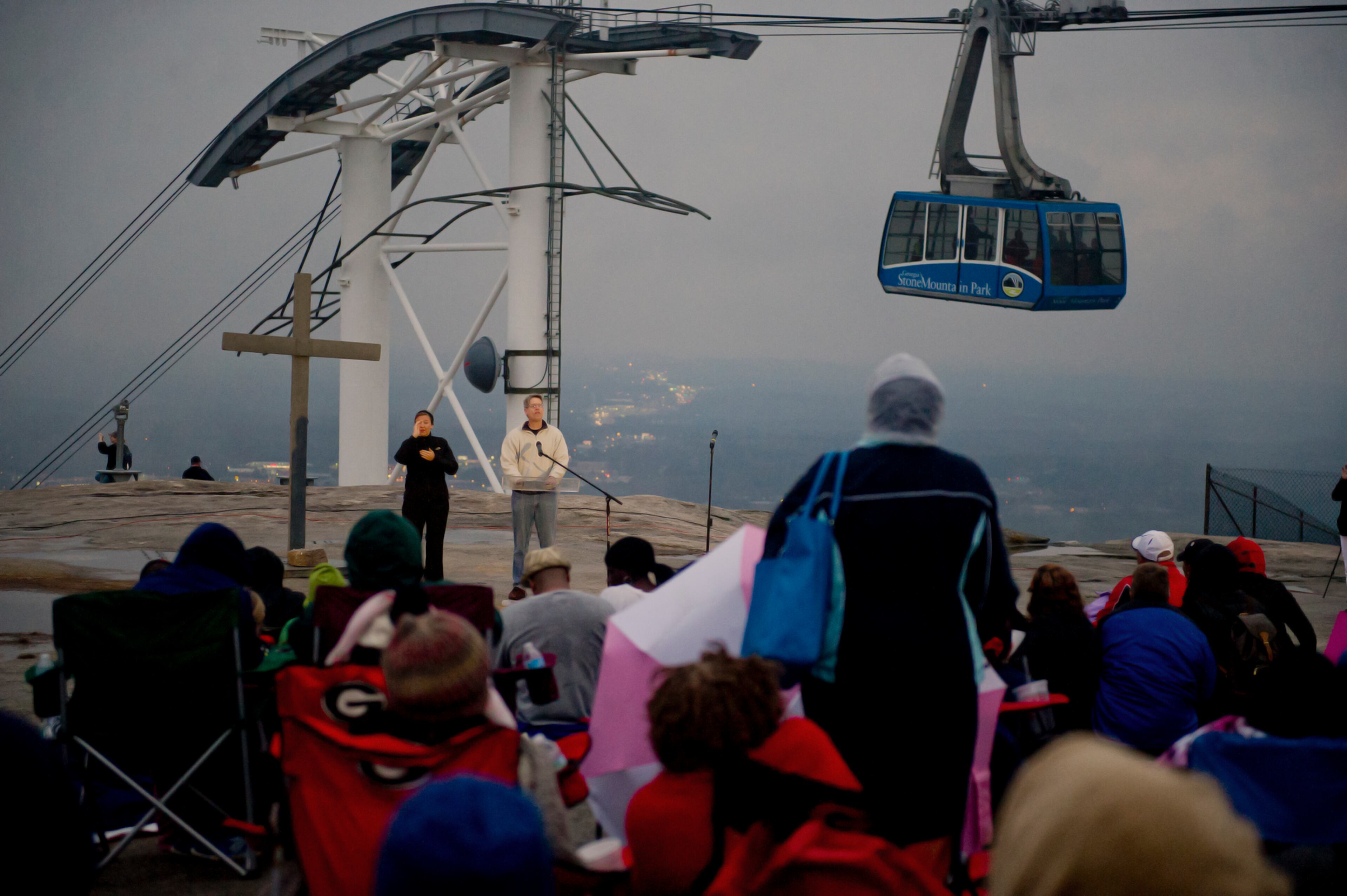 Dr. Paul Ballard (center) speaks to the crowd on top of Stone Mountain.